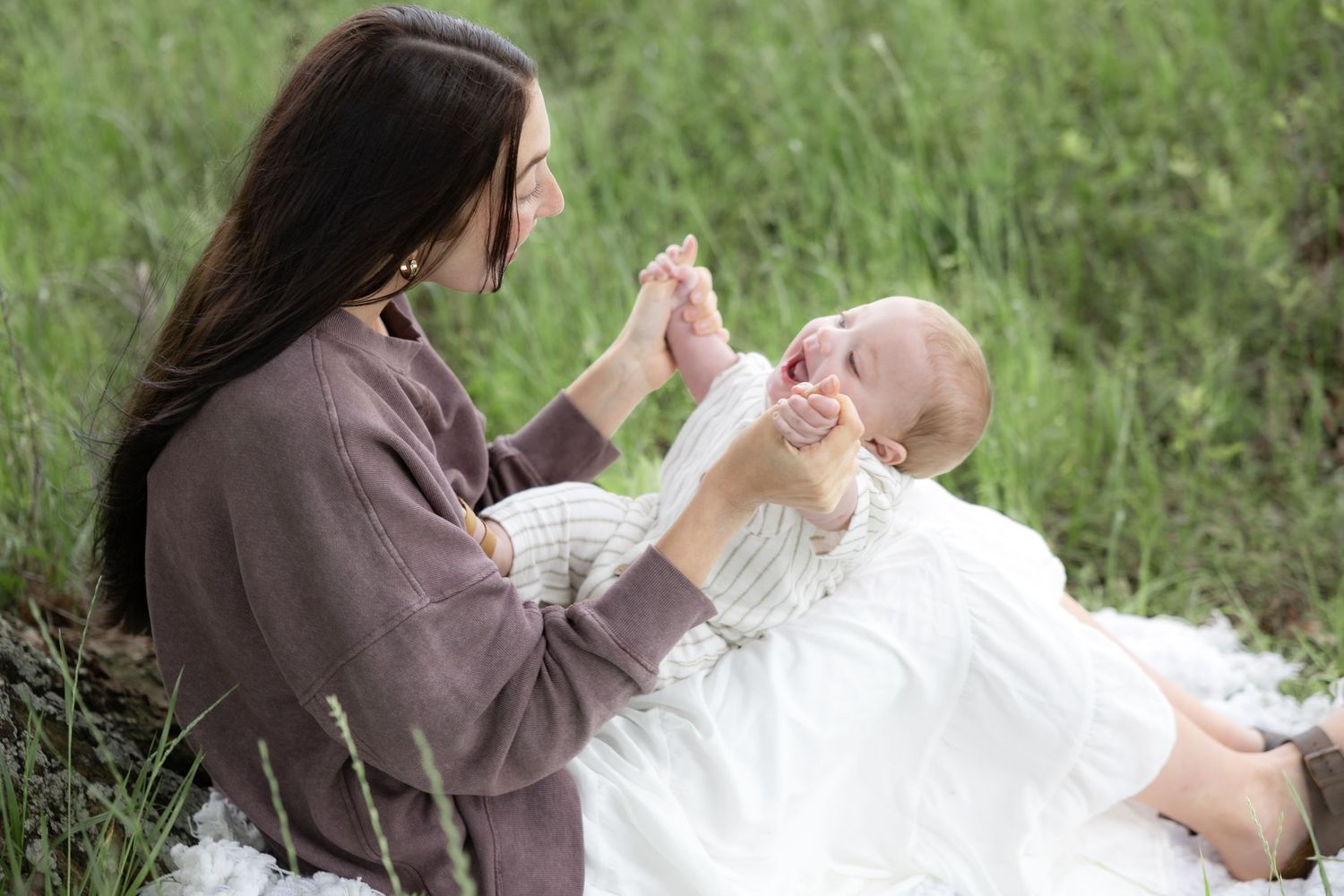 Candid family photos in a grass field | Dothan, Alabama Lifestyle Portrait Photographer