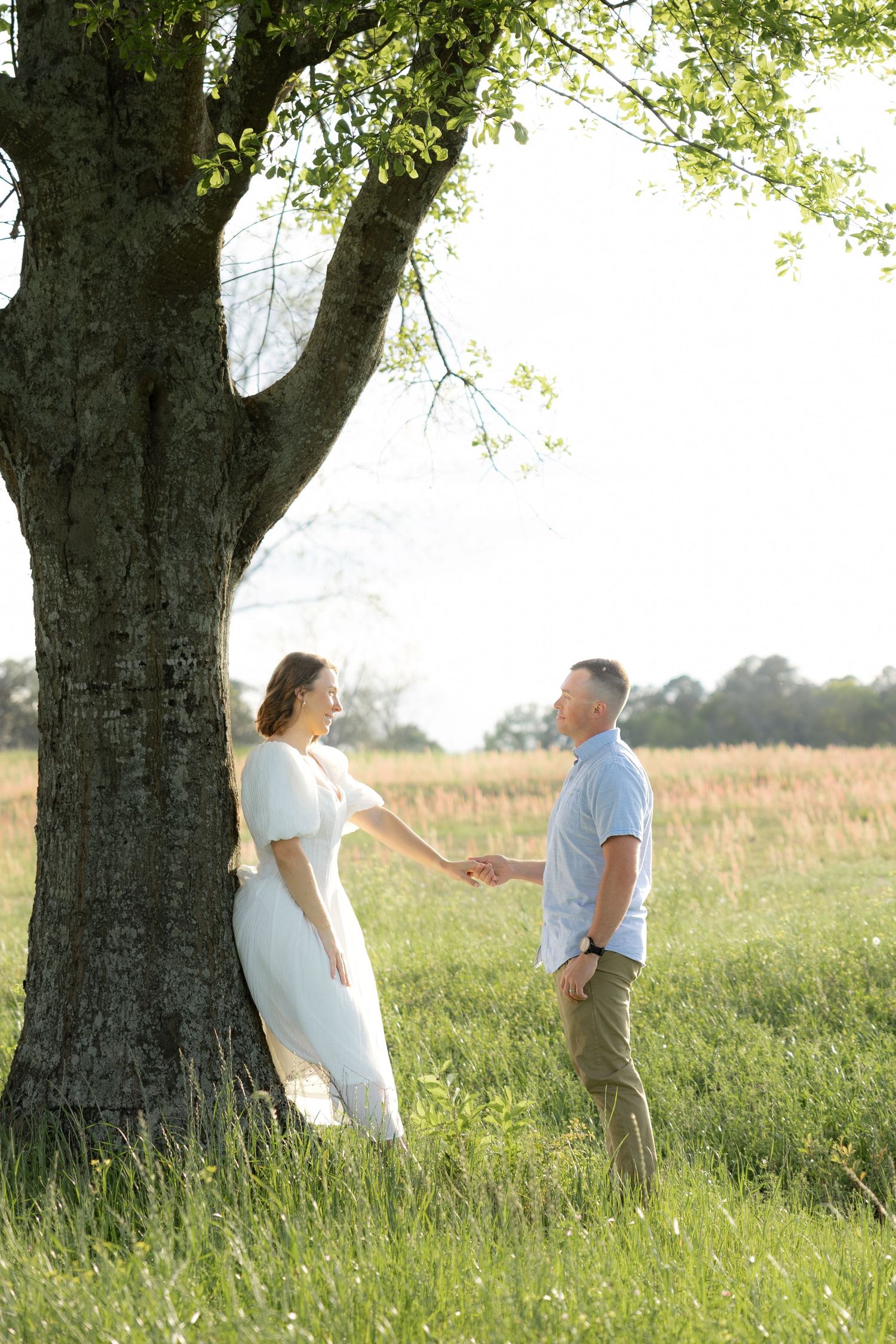 Storytelling romantic couple photos in a tall grass field at sunset in Dothan, Alabama