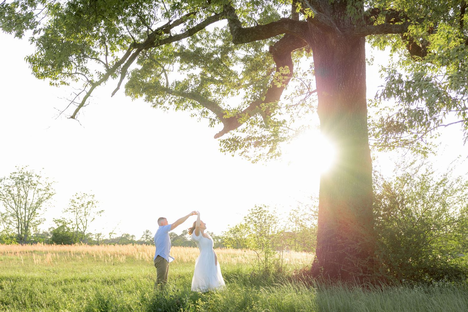 Storytelling couple photos in a tall grass field at sunset in Dothan, Alabama