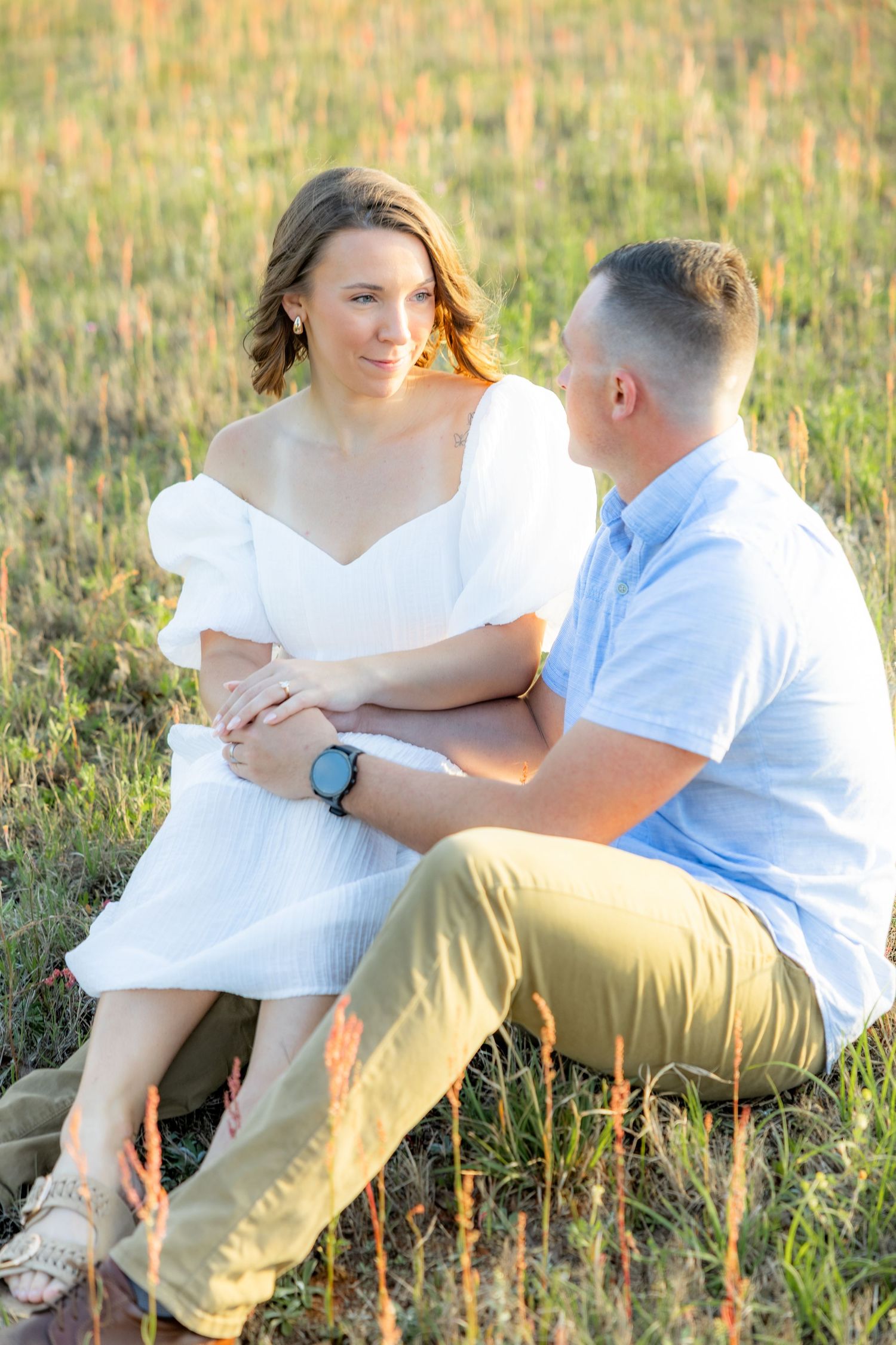 Storytelling couple photos in a tall grass field at sunset in Dothan, Alabama