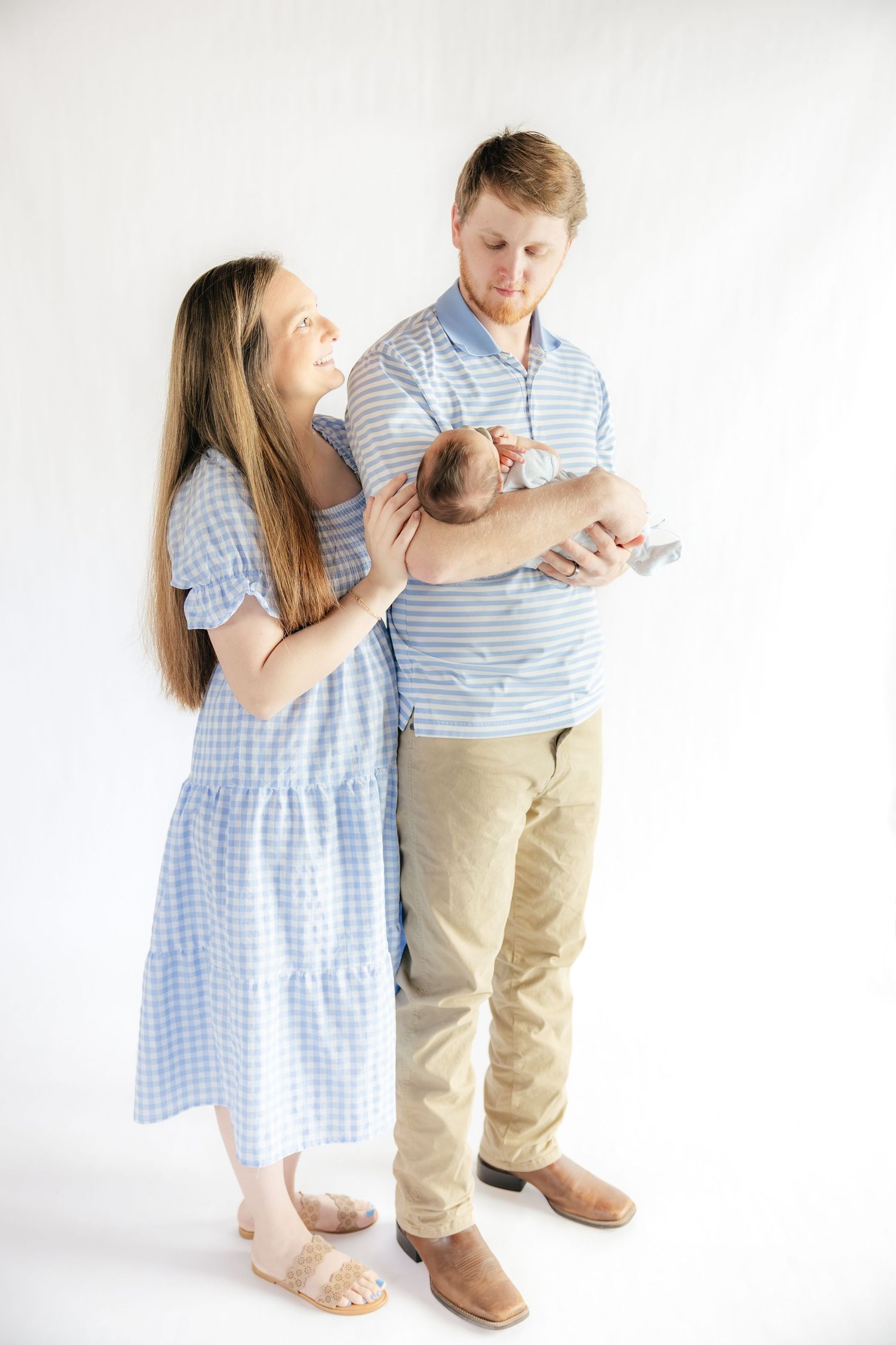 Family holding their baby in a studio in Dothan, Alabama