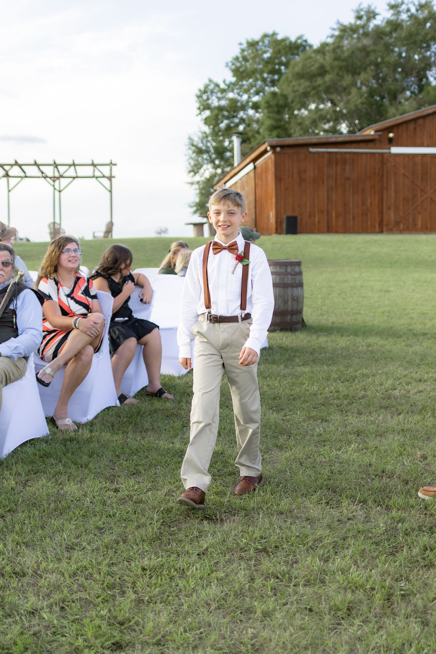 Bridal party walking down the aisle of a wedding at Hilltop Acres Wicksburg, Alabama