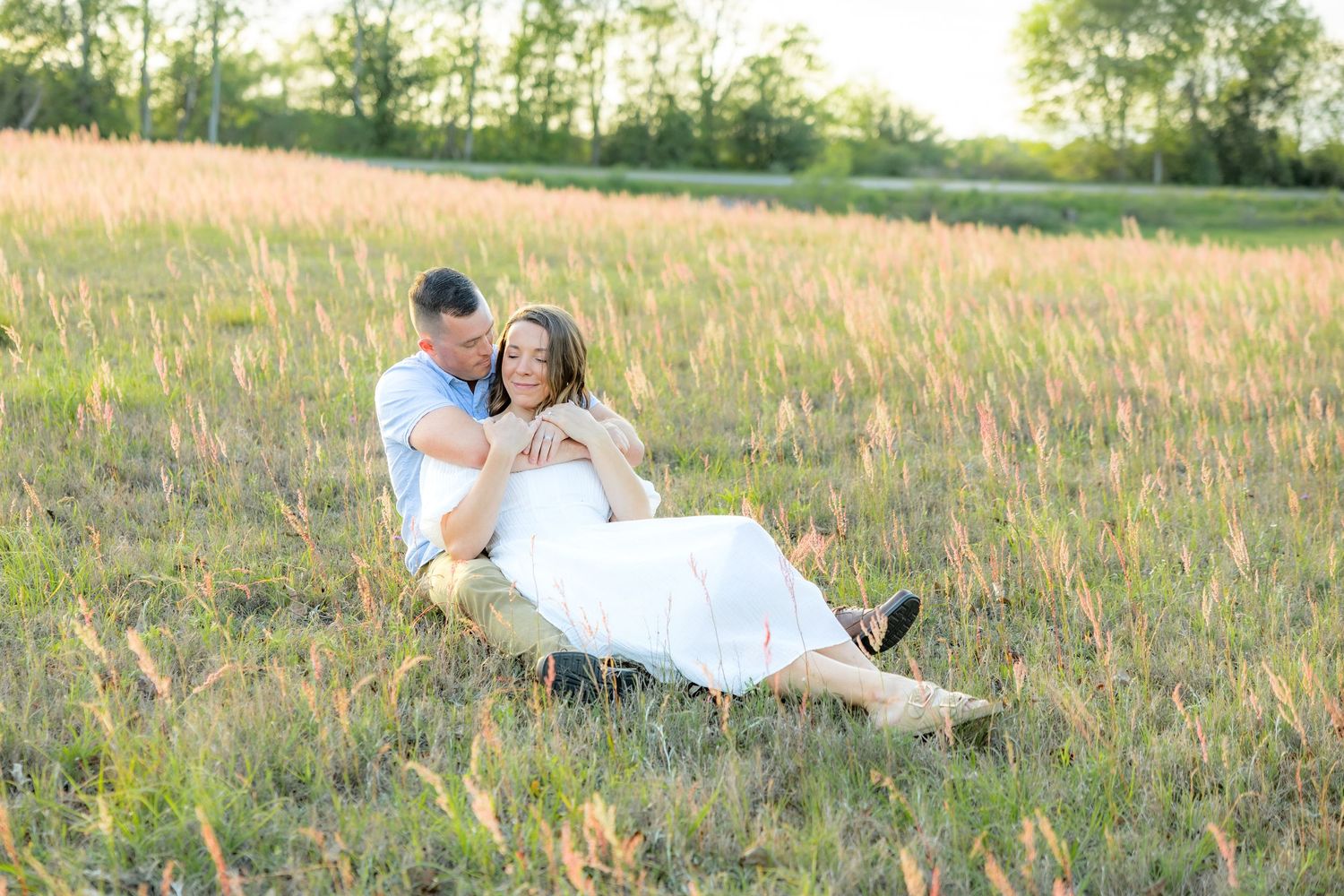 Storytelling couple photos in a tall grass field at sunset in Dothan, Alabama