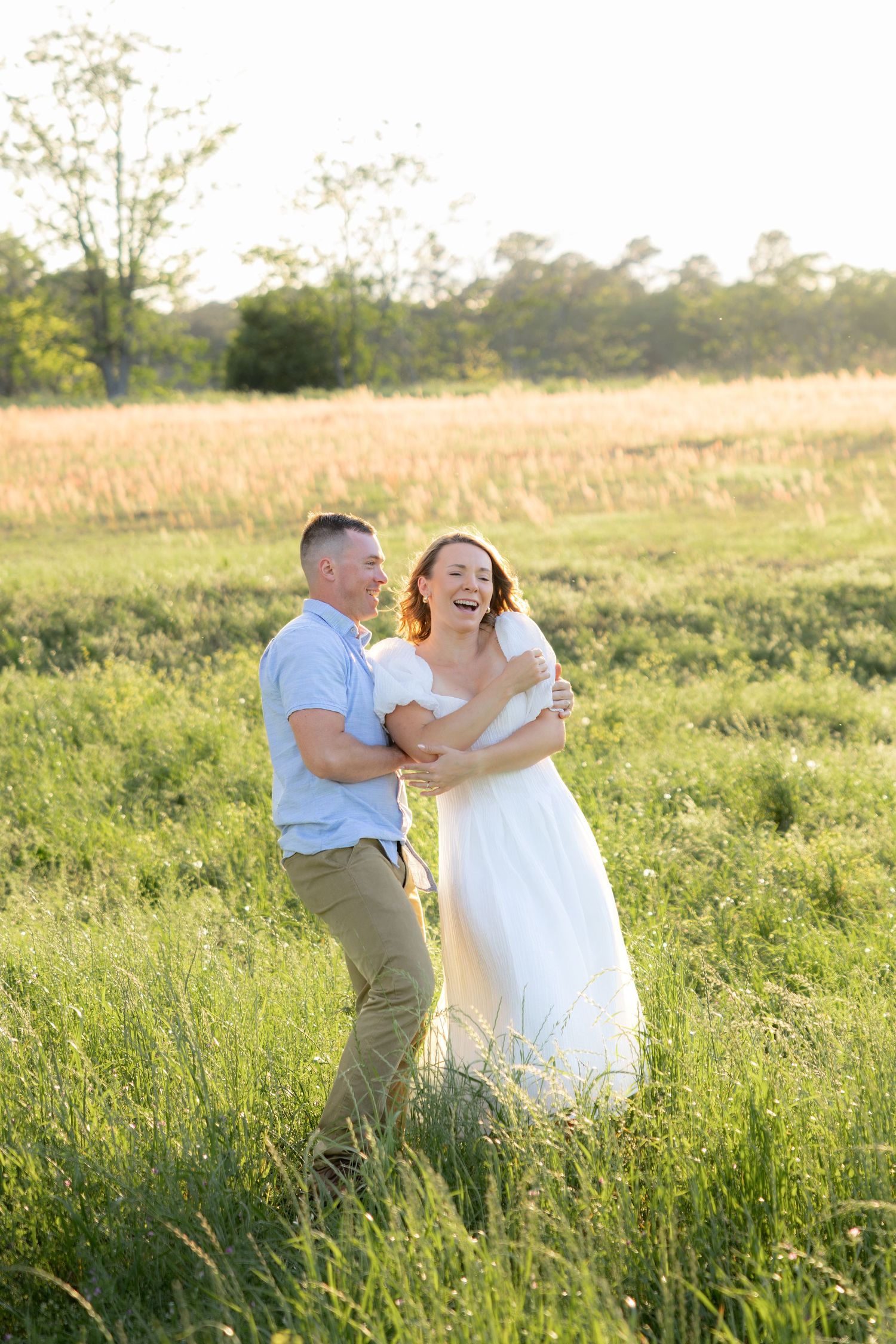 Storytelling couple photos in a tall grass field at sunset in Dothan, Alabama