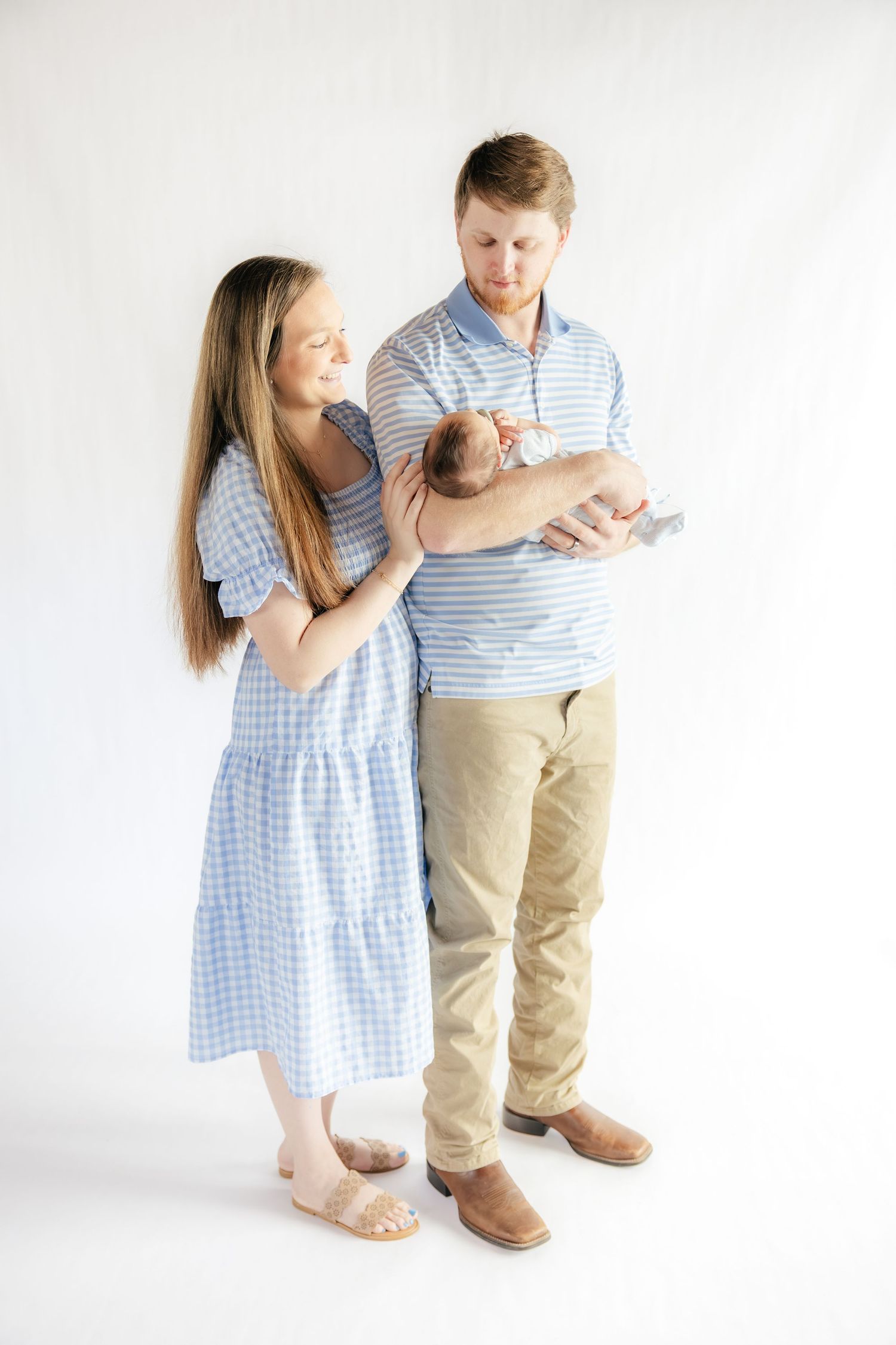 Family holding their baby in a studio in Dothan, Alabama