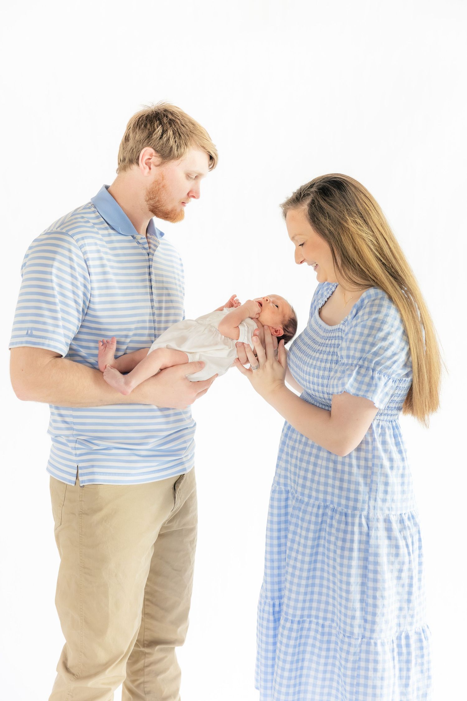 Family holding their baby in a studio in Dothan, Alabama