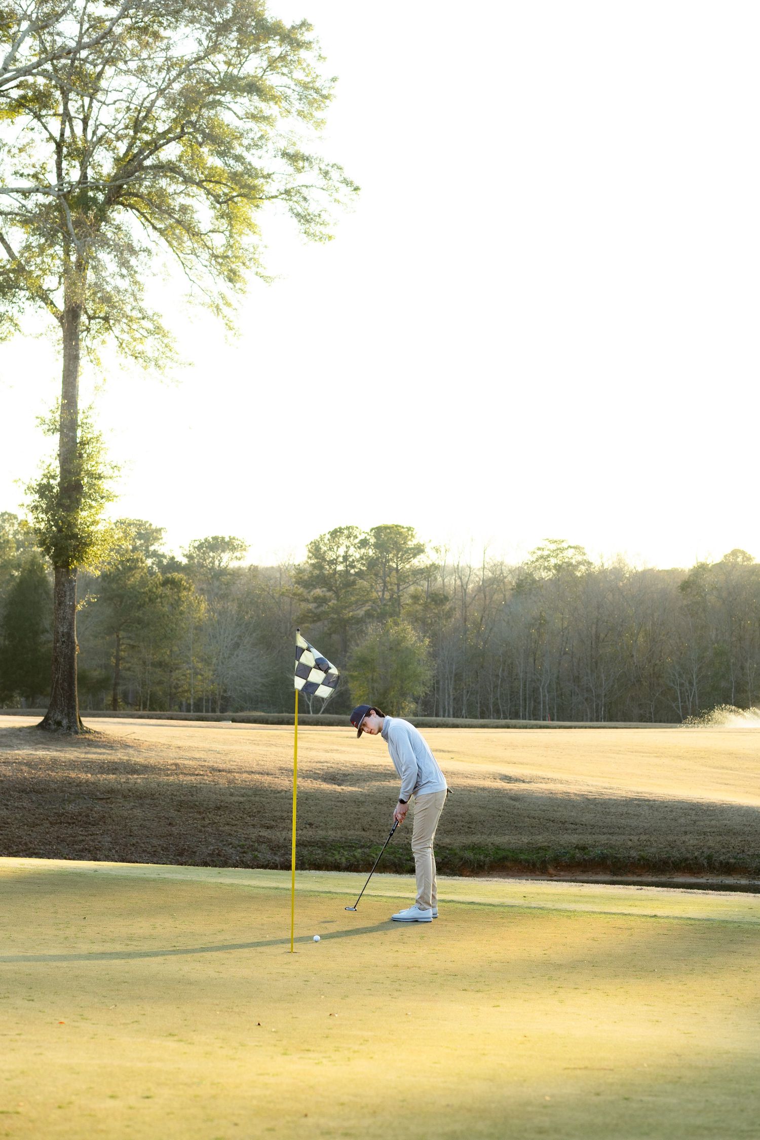 Senior playing golf on a golf course in Enterprise, Alabama