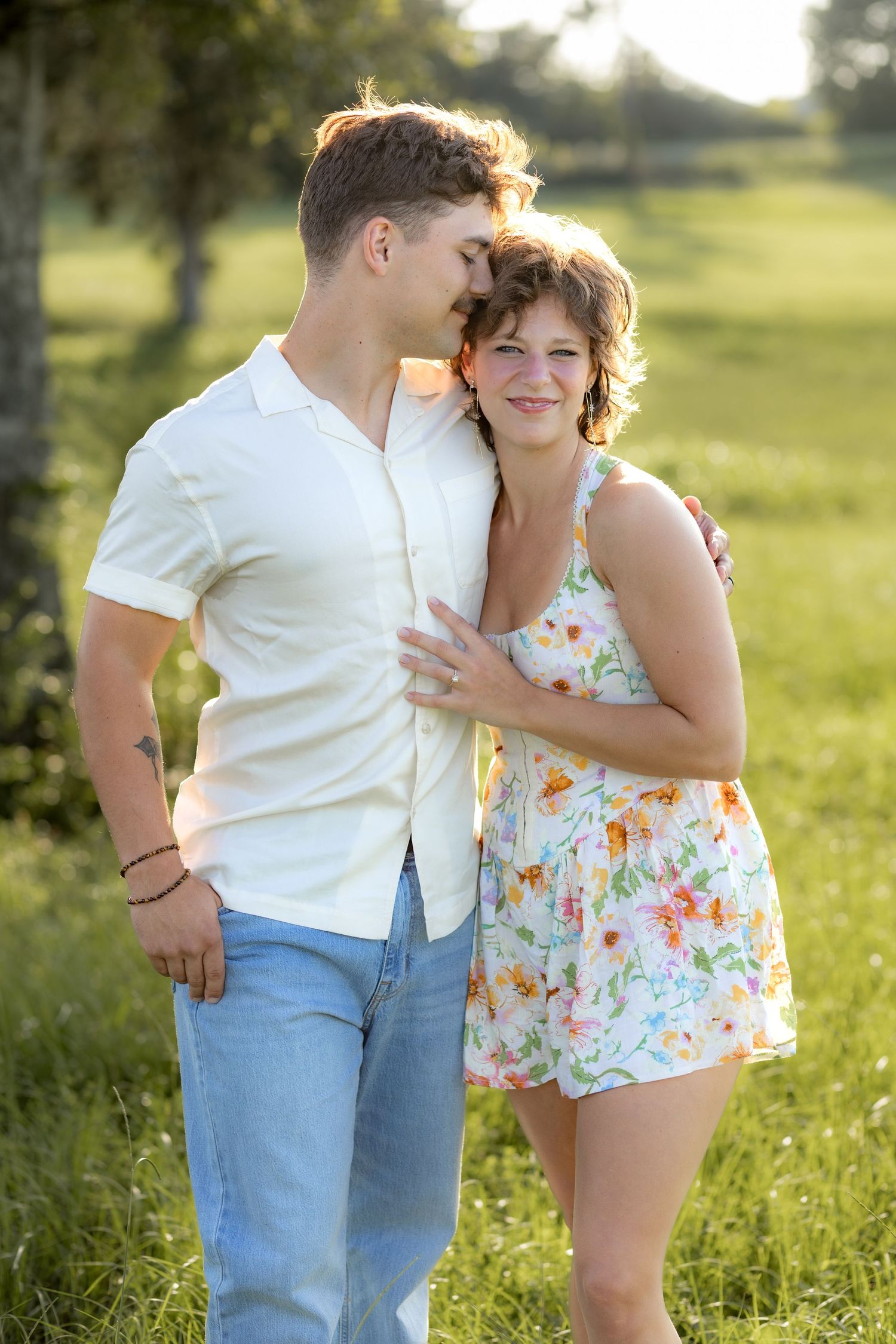 Romantic Couples photos in a tall grass field at sunset near Dothan, Alabama