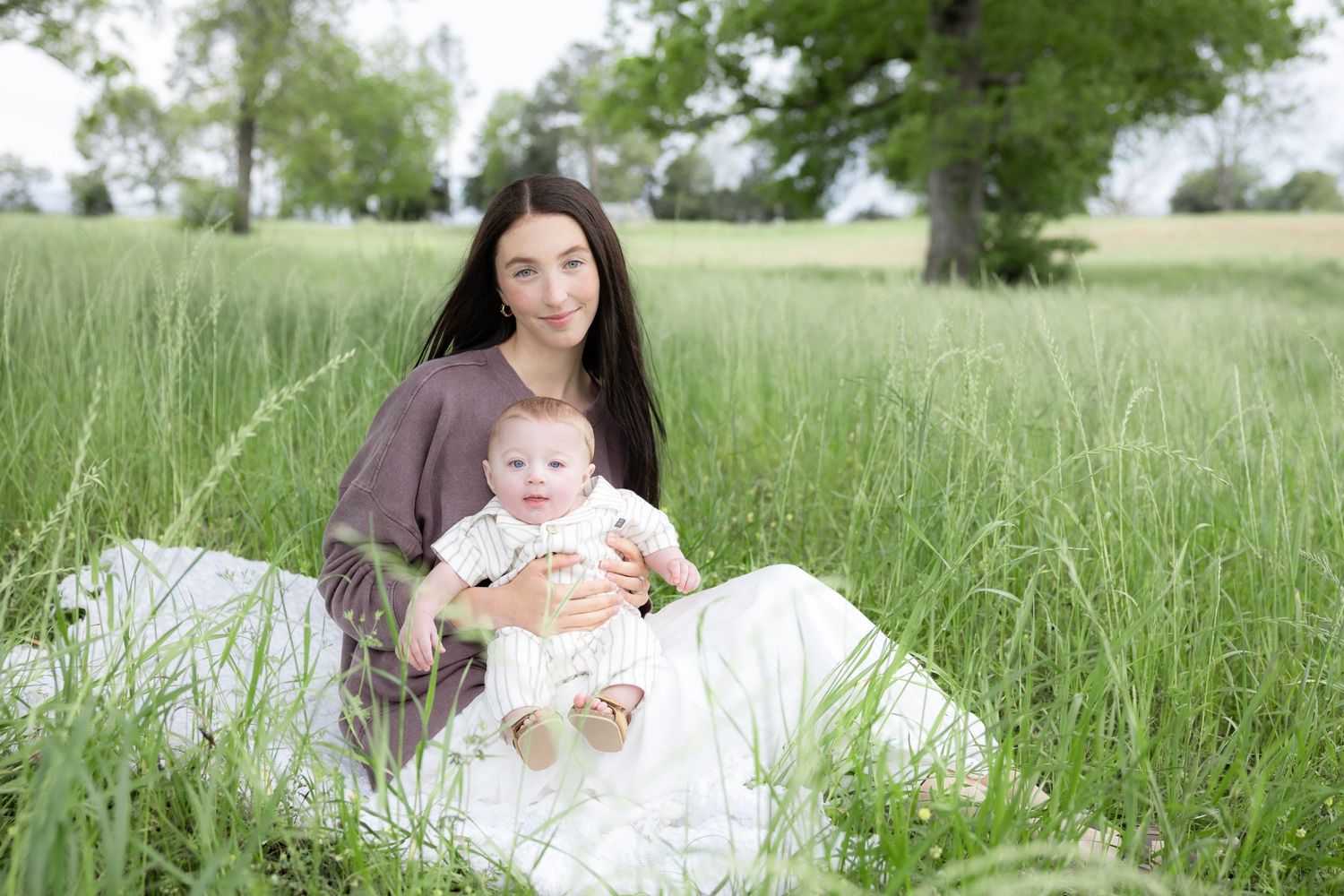 Candid family photos in a grass field | Dothan, Alabama Lifestyle Portrait Photographer