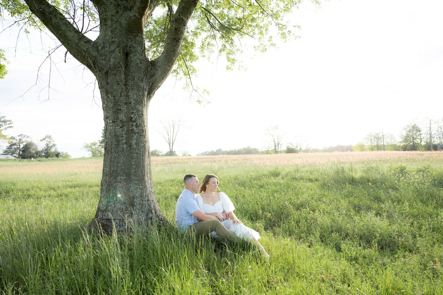 Storytelling romantic couple photos in a tall grass field at sunset in Dothan, Alabama