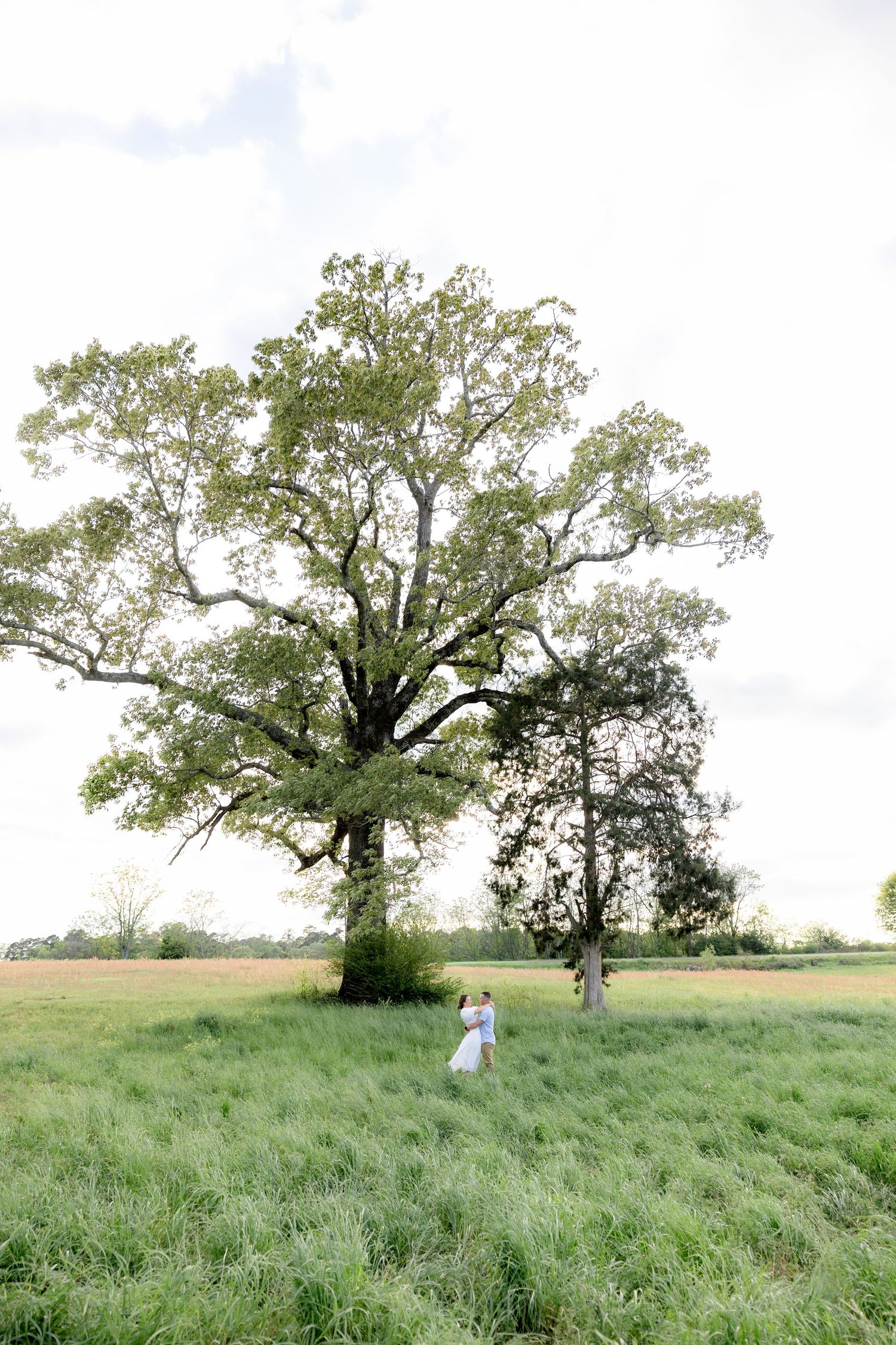 Storytelling romantic couple photos in a tall grass field at sunset in Dothan, Alabama