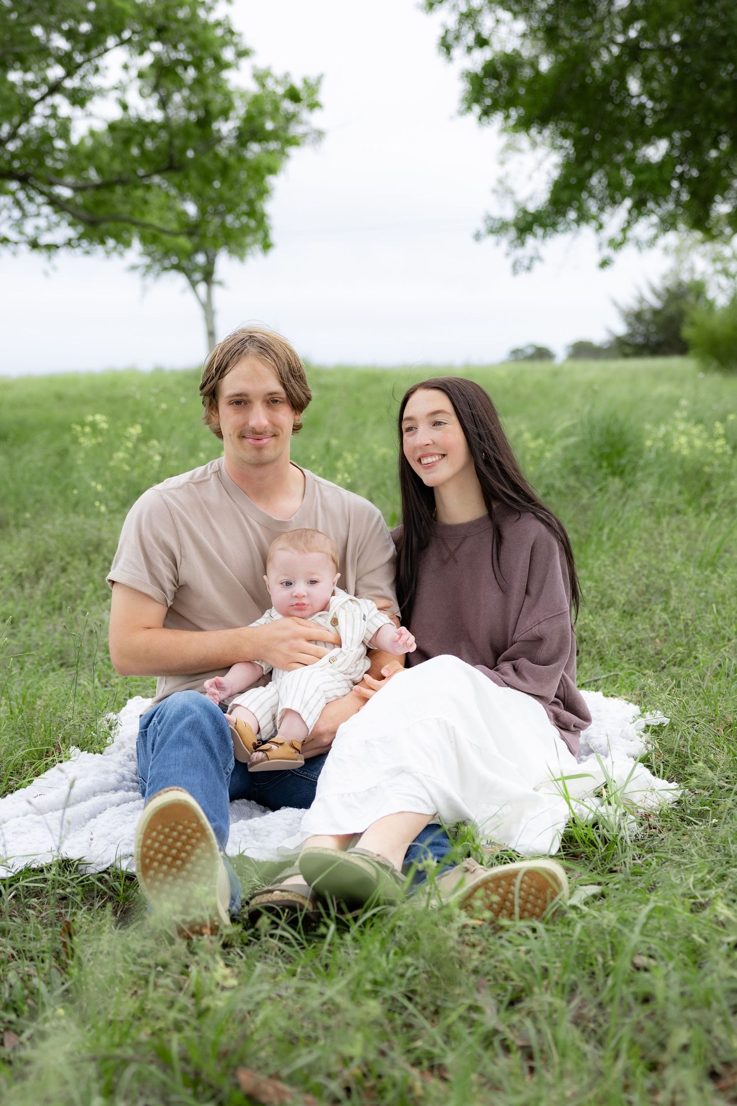 Candid family photos in a grass field | Dothan, Alabama Lifestyle Portrait Photographer