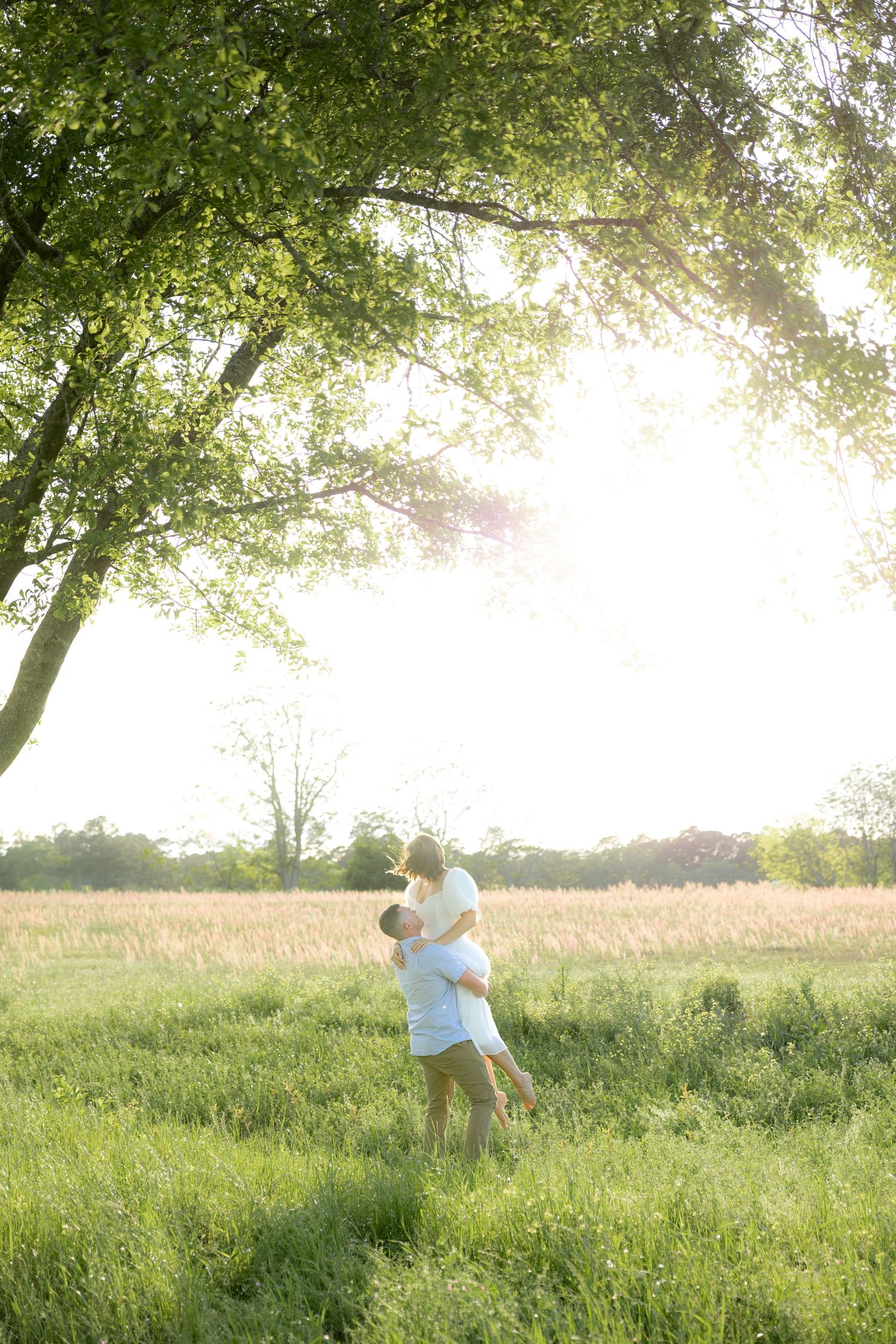 Storytelling couple photos in a tall grass field at sunset in Dothan, Alabama