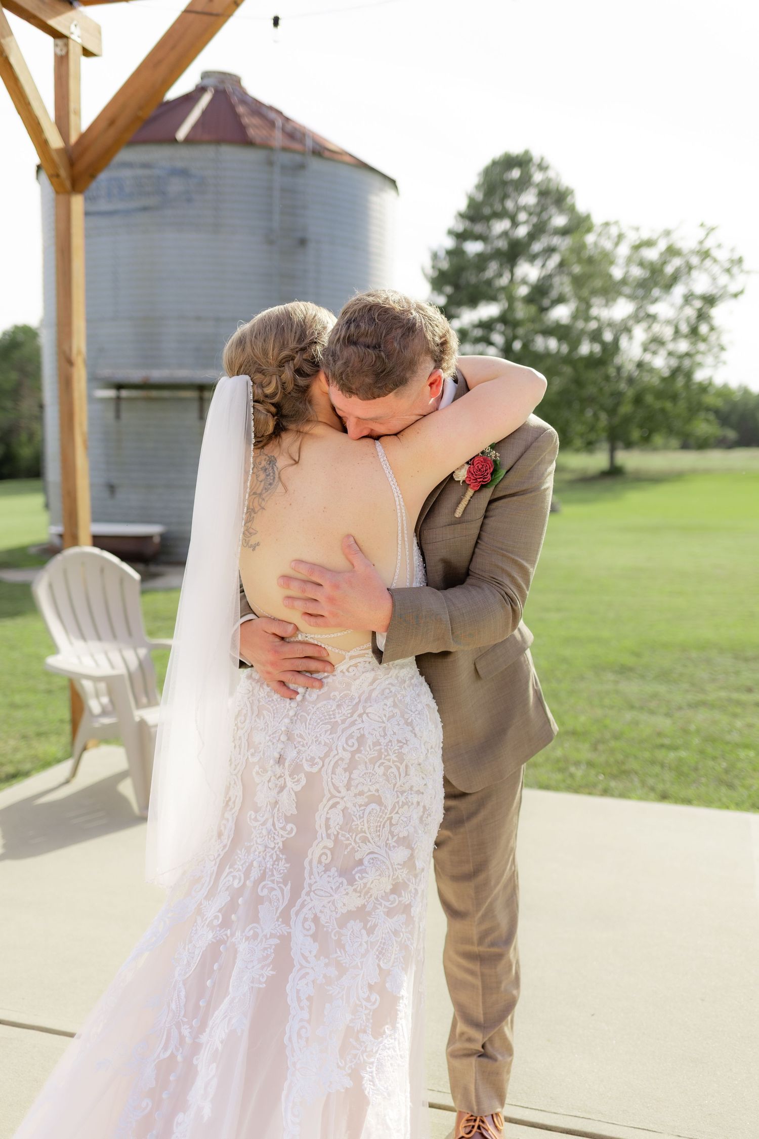 Groom first look with bride underneath the gazebo at Hilltop Acres Wicksburg, Alabama