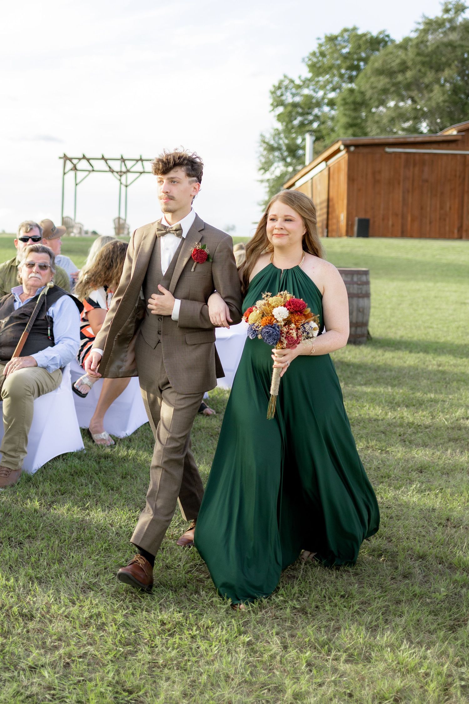 Bridal party walking down the aisle of a wedding at Hilltop Acres Wicksburg, Alabama