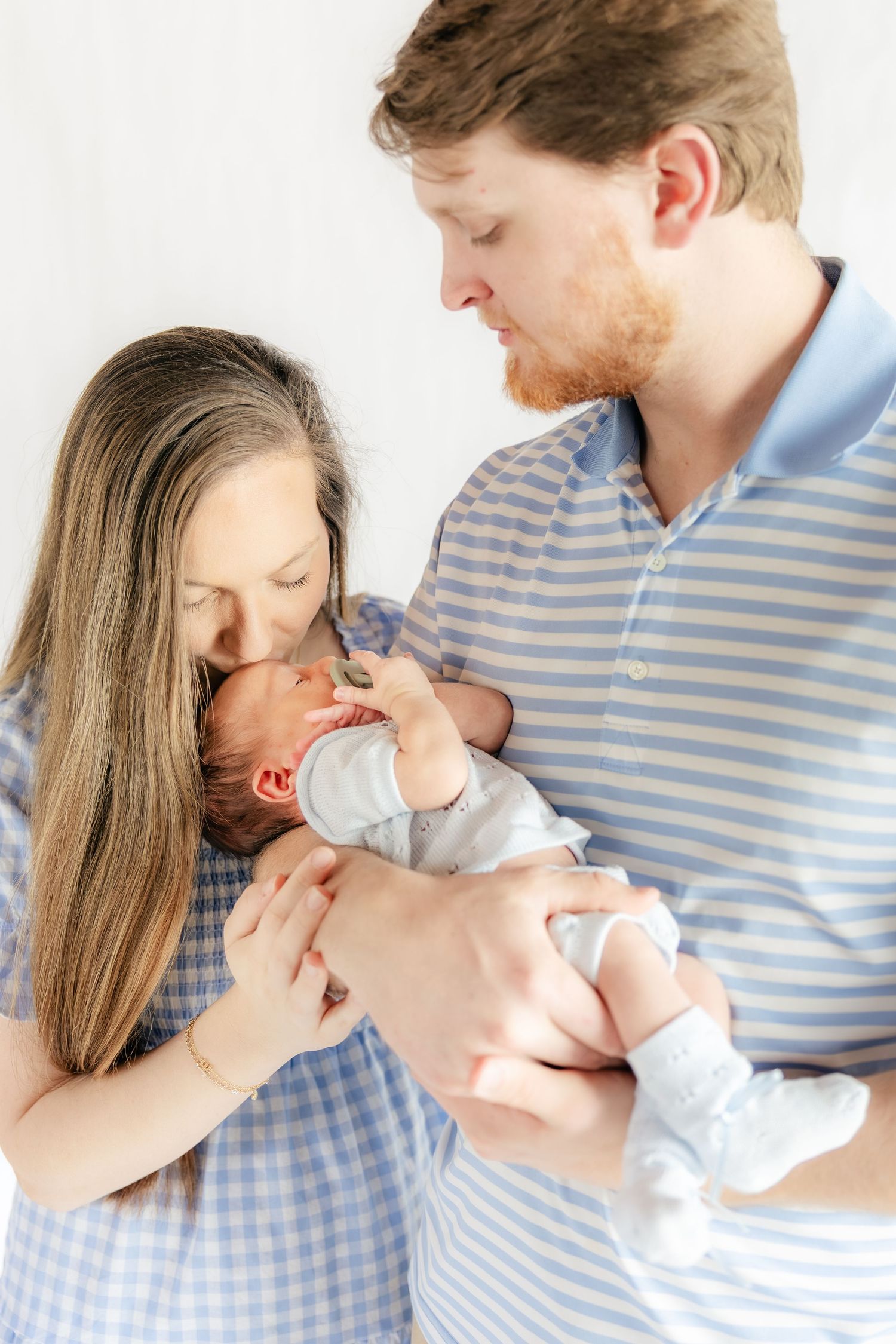 Family holding their baby in a studio in Dothan, Alabama