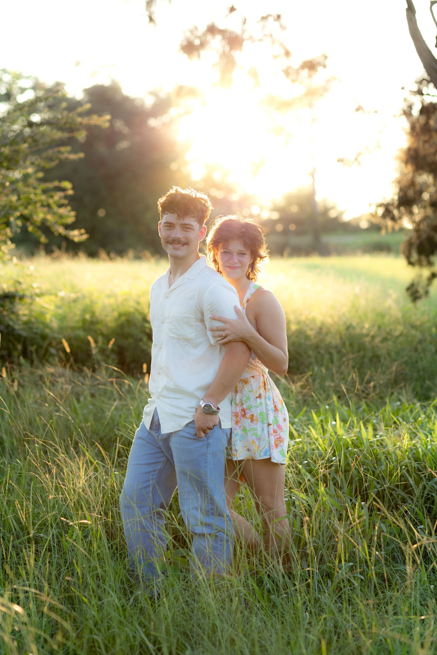 Romantic Couples photos in a tall grass field at sunset near Dothan, Alabama