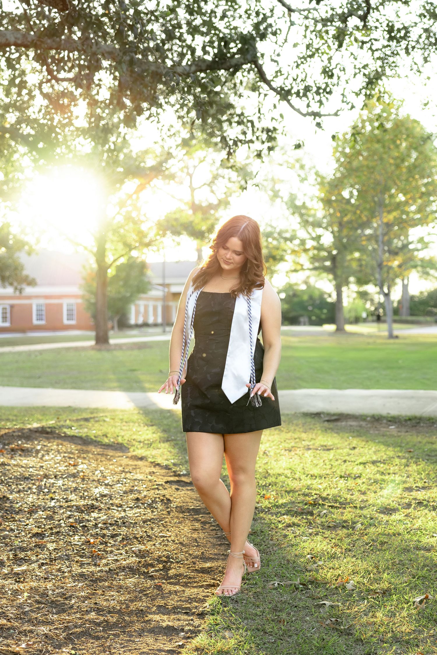 Senior portraits during sunset at Troy University Dothan Campus