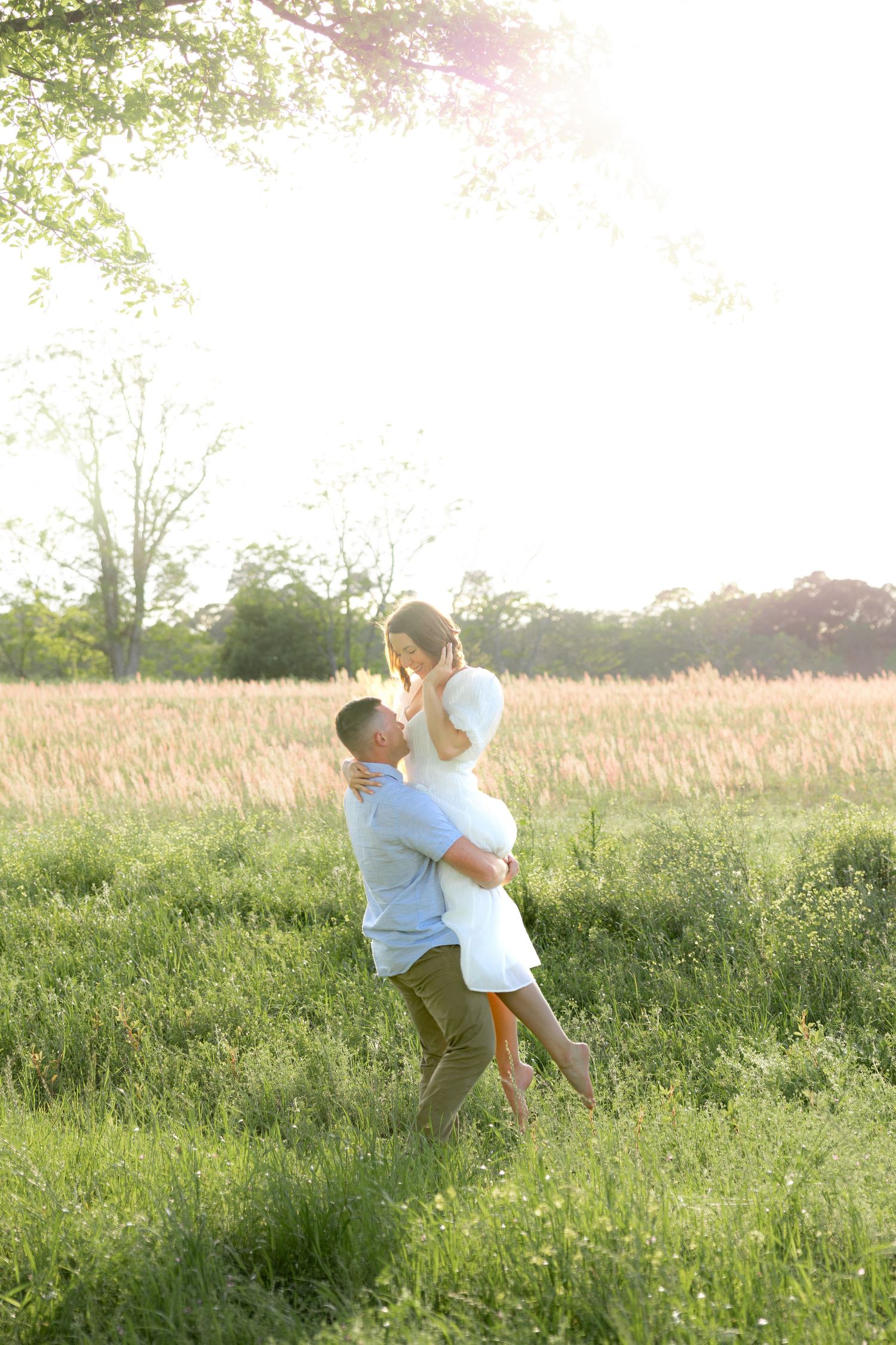 Storytelling couple photos in a tall grass field at sunset in Dothan, Alabama