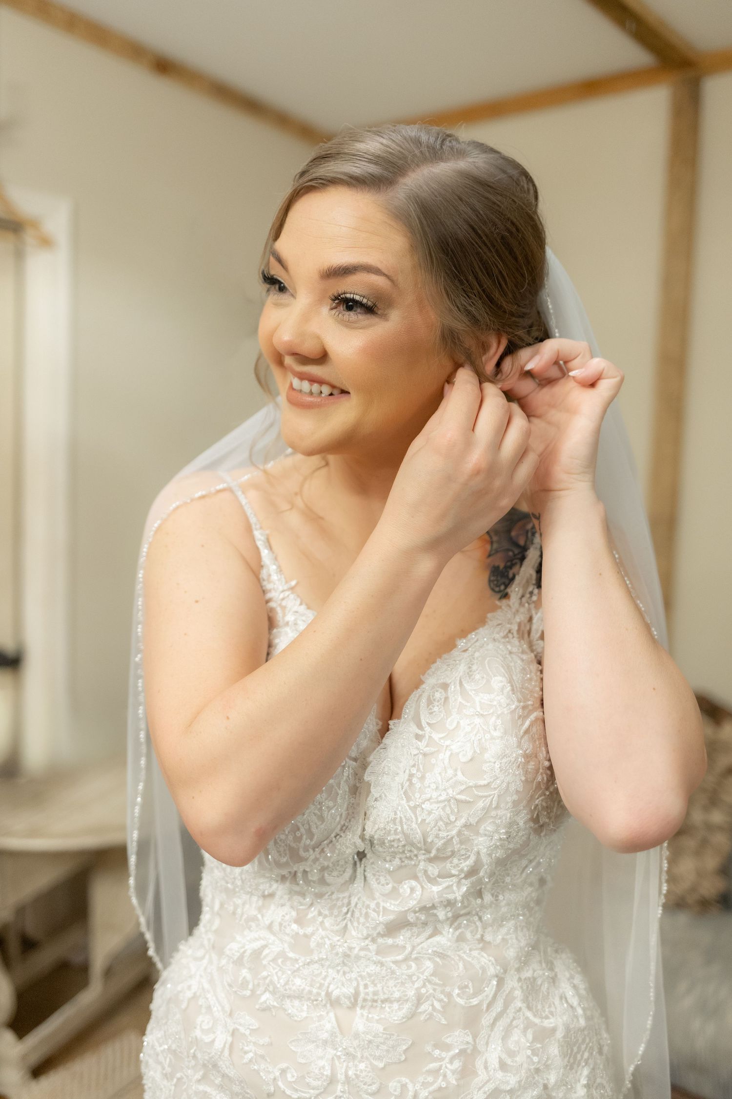 Bride getting ready on her wedding day at Hilltop Acres Wicksburg, Alabama