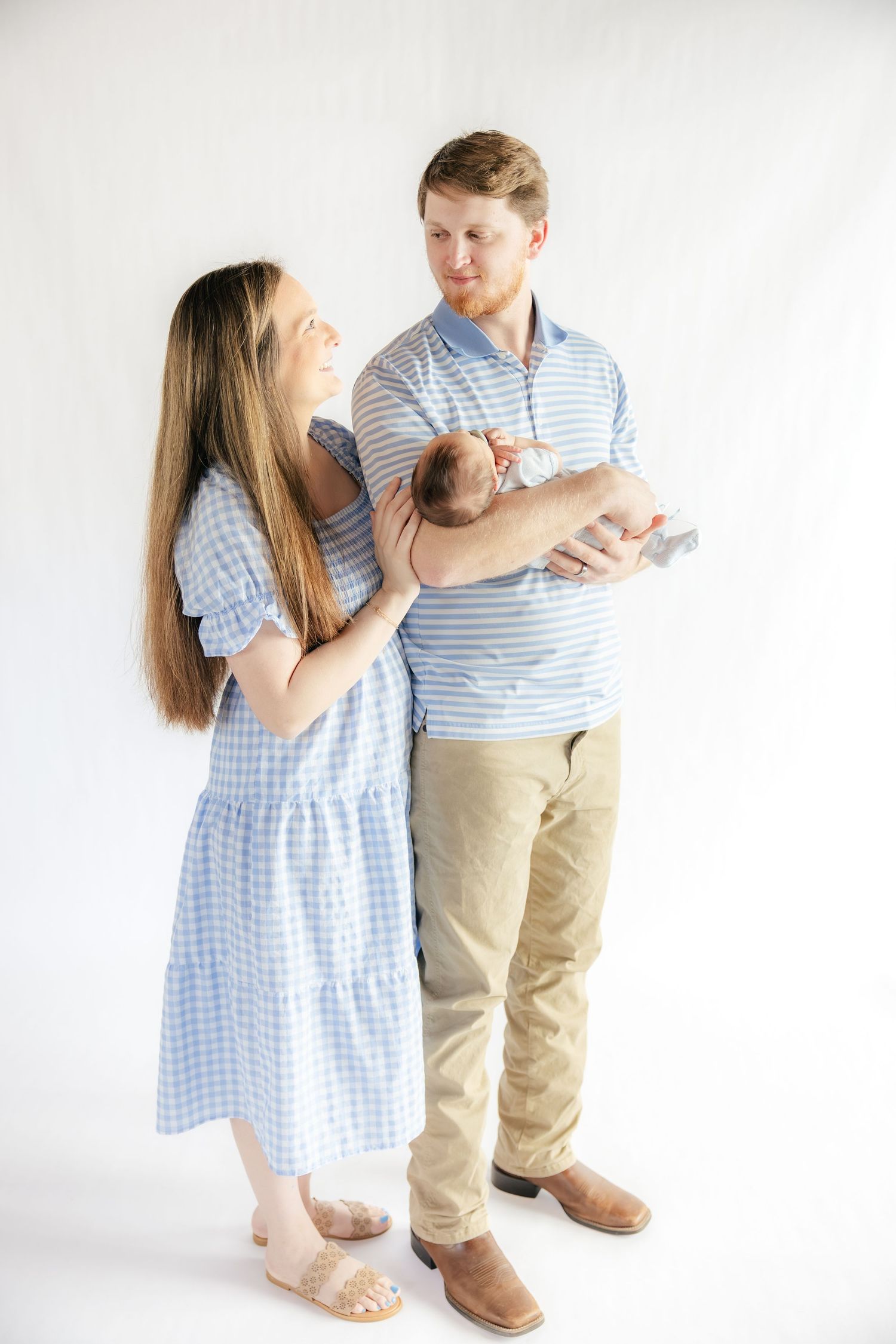 Family holding their baby in a studio in Dothan, Alabama
