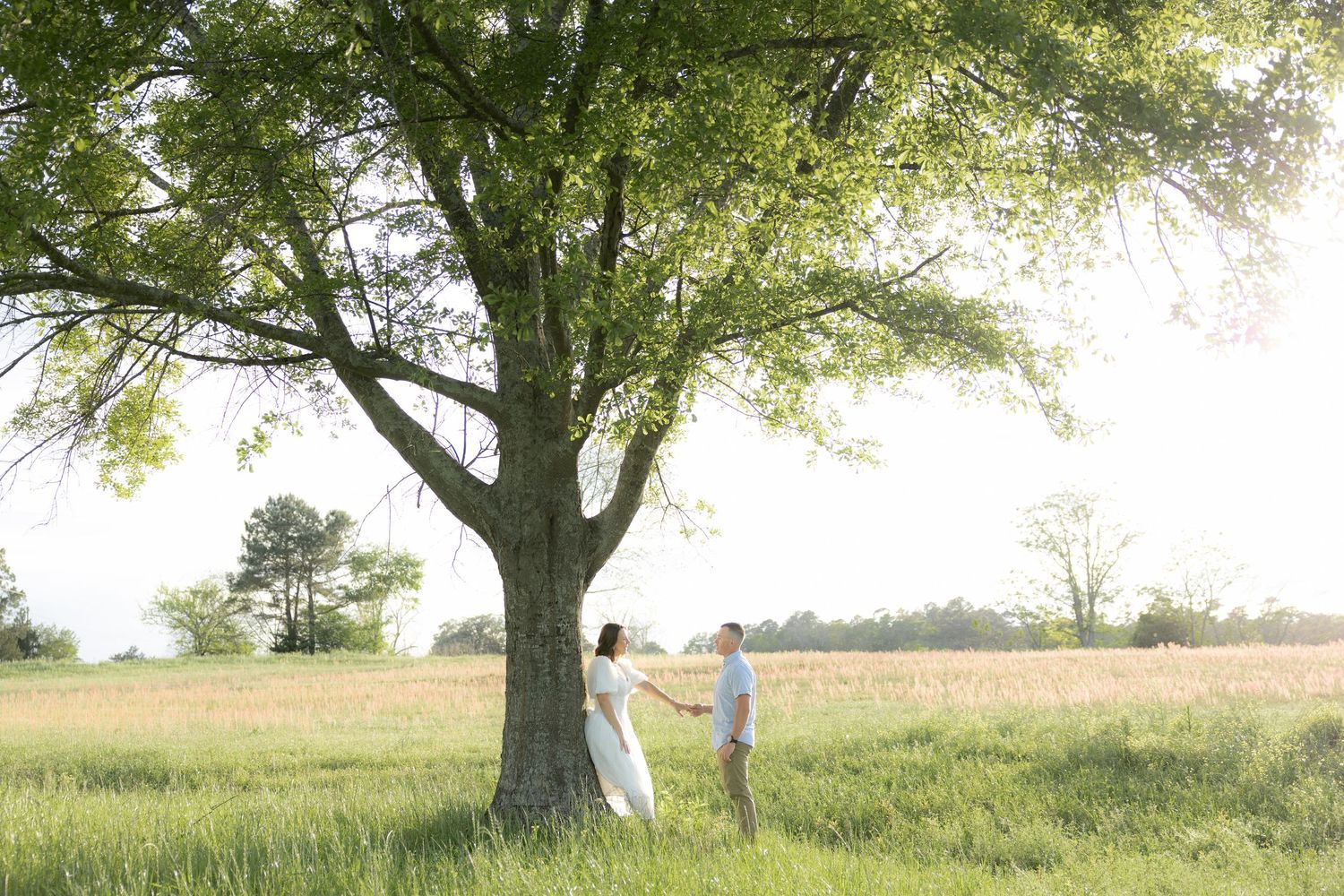 Storytelling romantic couple photos in a tall grass field at sunset in Dothan, Alabama