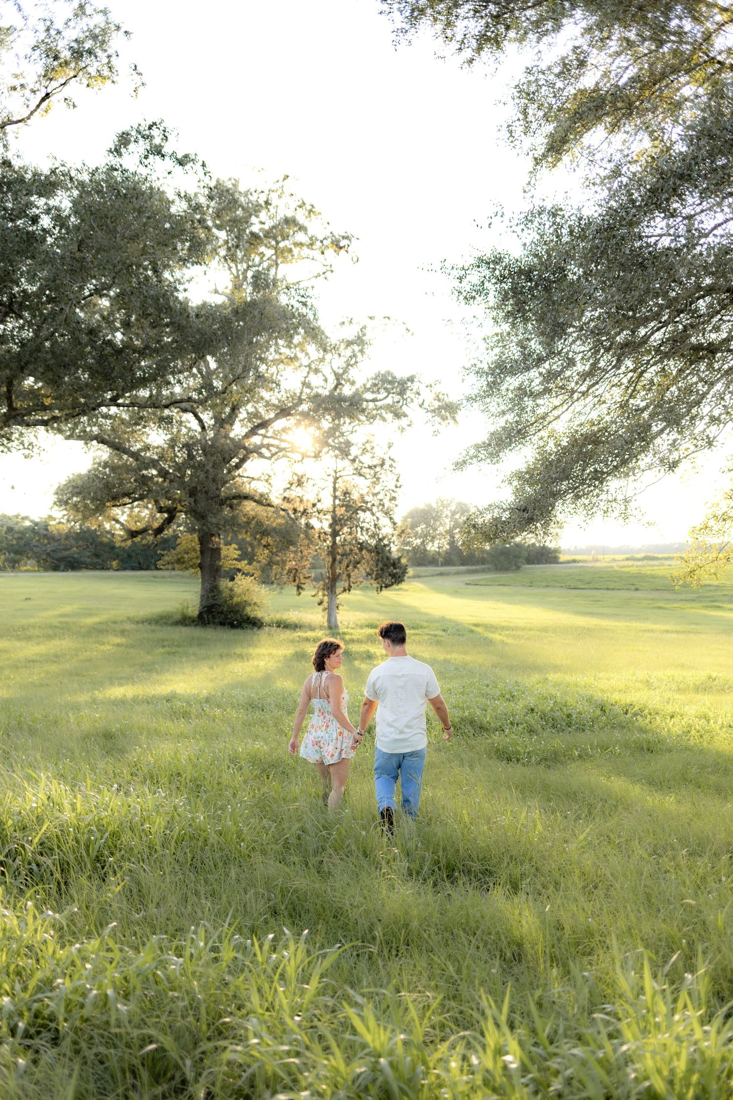 Romantic Couples photos in a tall grass field at sunset near Dothan, Alabama