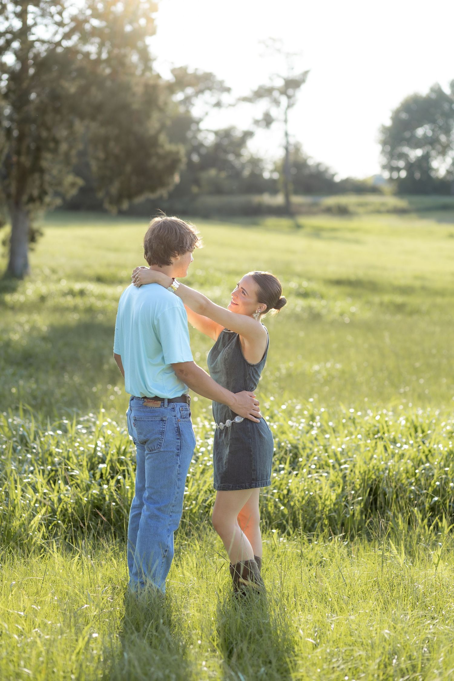 Romantic Couples photos in a tall grass field at sunset near Dothan, Alabama