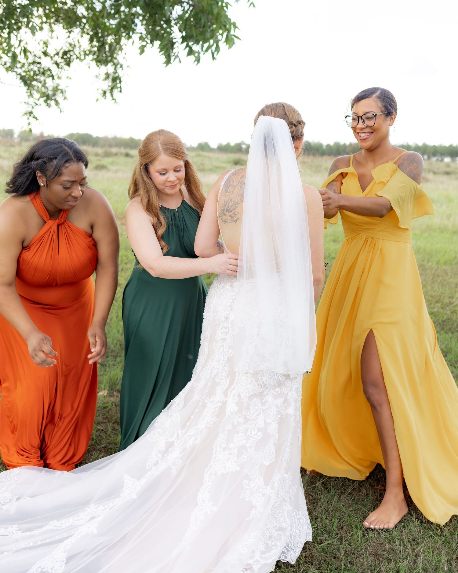 Bridal party posing in a field at sunset at Hilltop Acres Wicksburg, Alabama