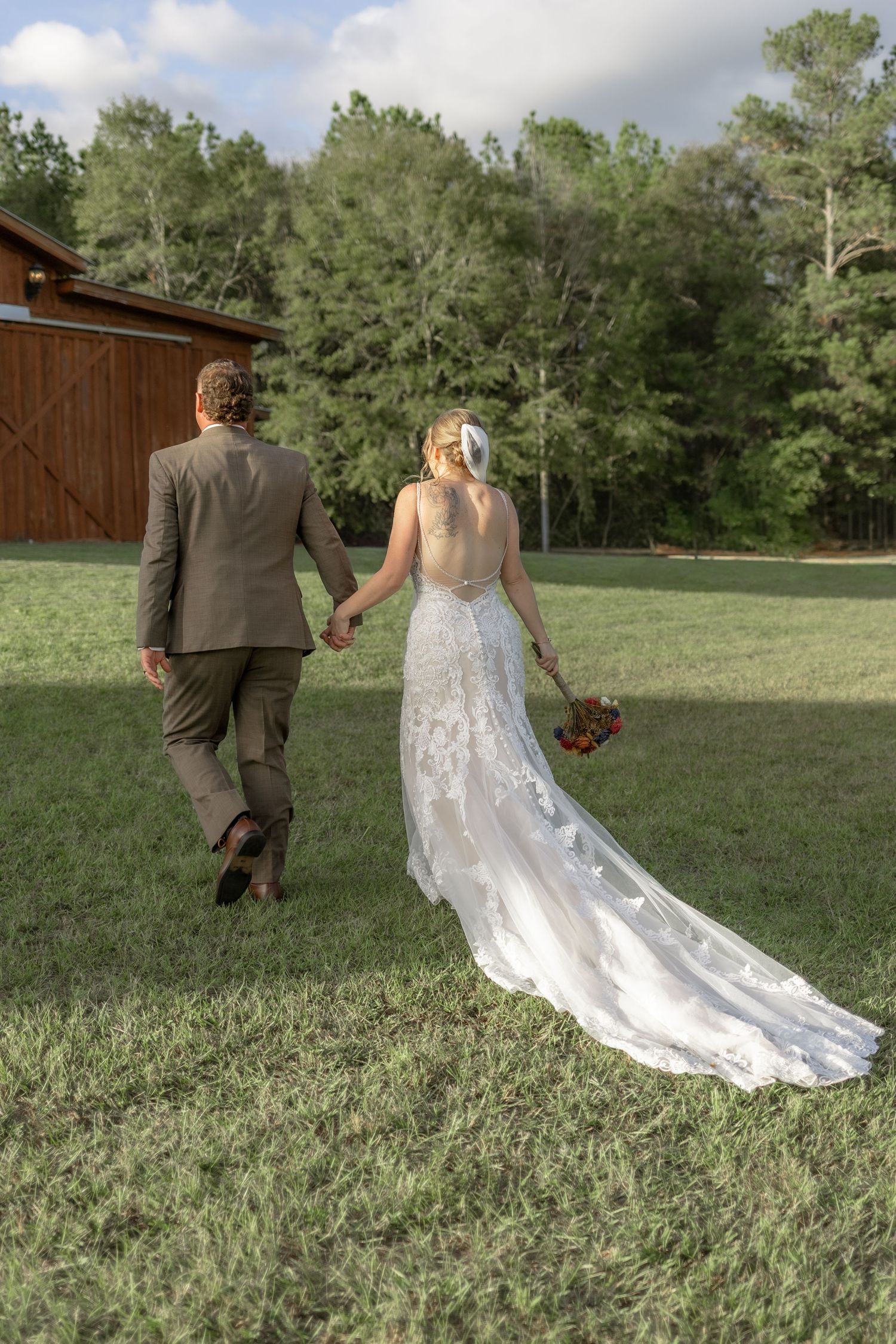 Bride and groom exiting their ceremony at Hilltop Acres Wicksburg, Alabama