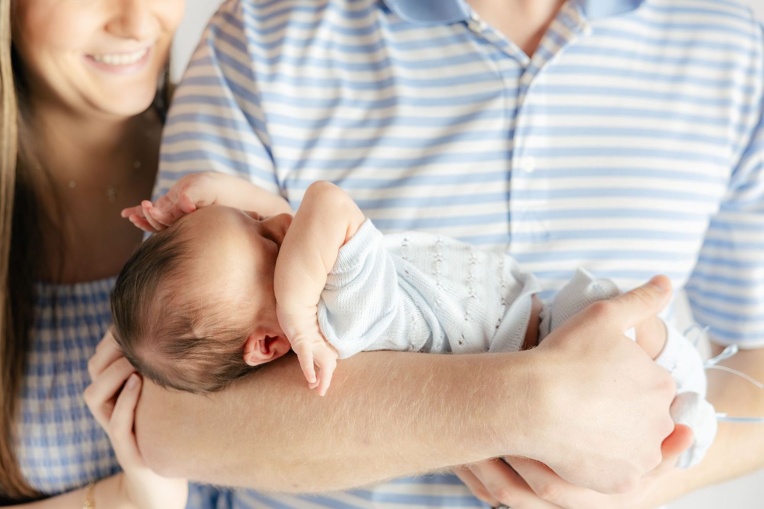 Family holding their baby in a studio in Dothan, Alabama