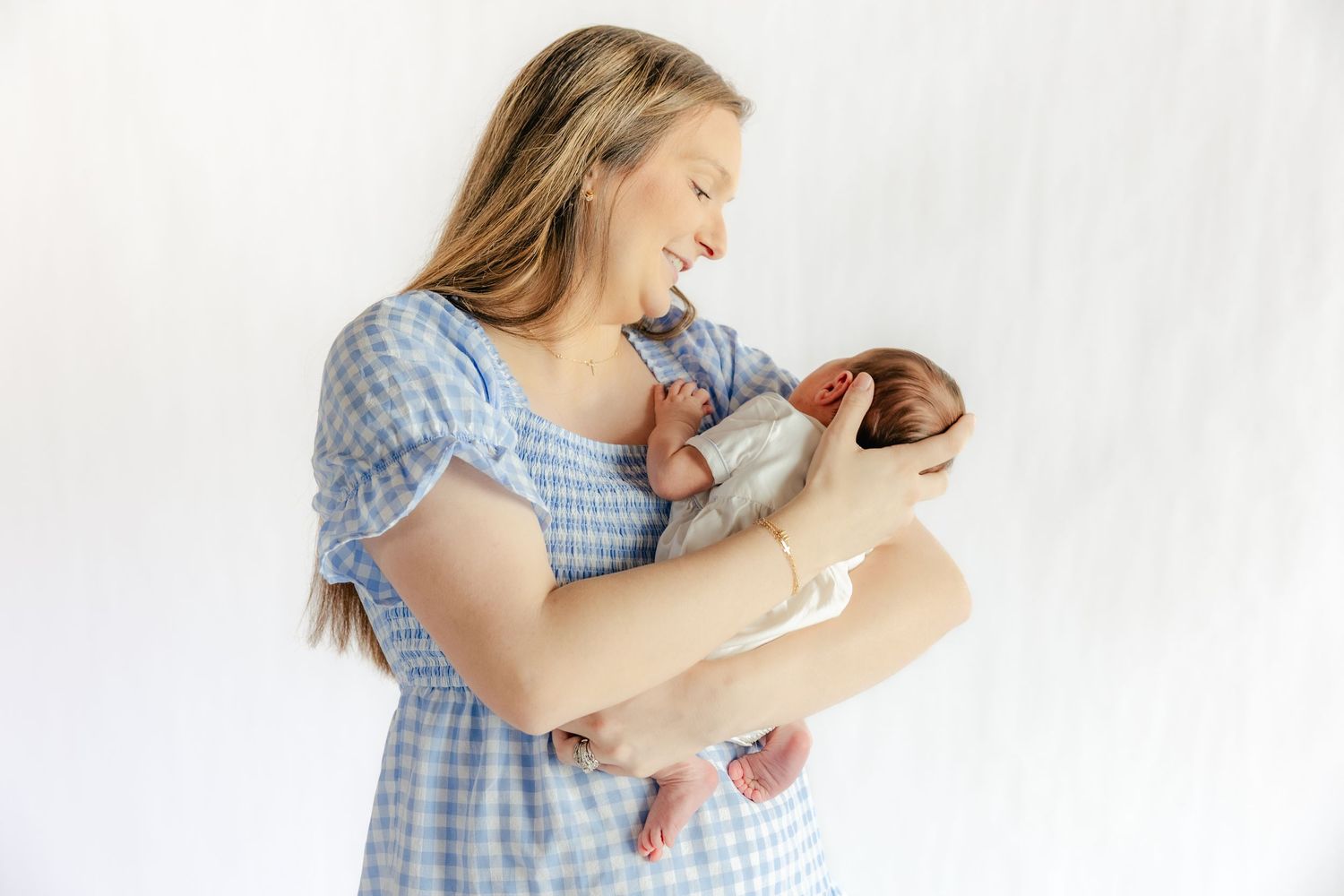 Mother holding her baby in a studio in Dothan, Alabama