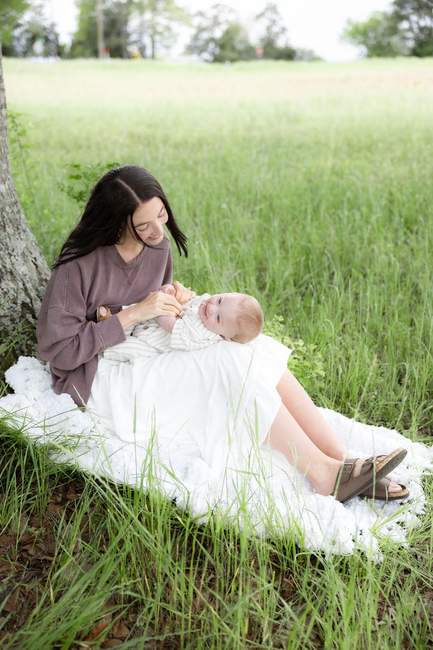 Candid family photos in a grass field | Dothan, Alabama Lifestyle Portrait Photographer