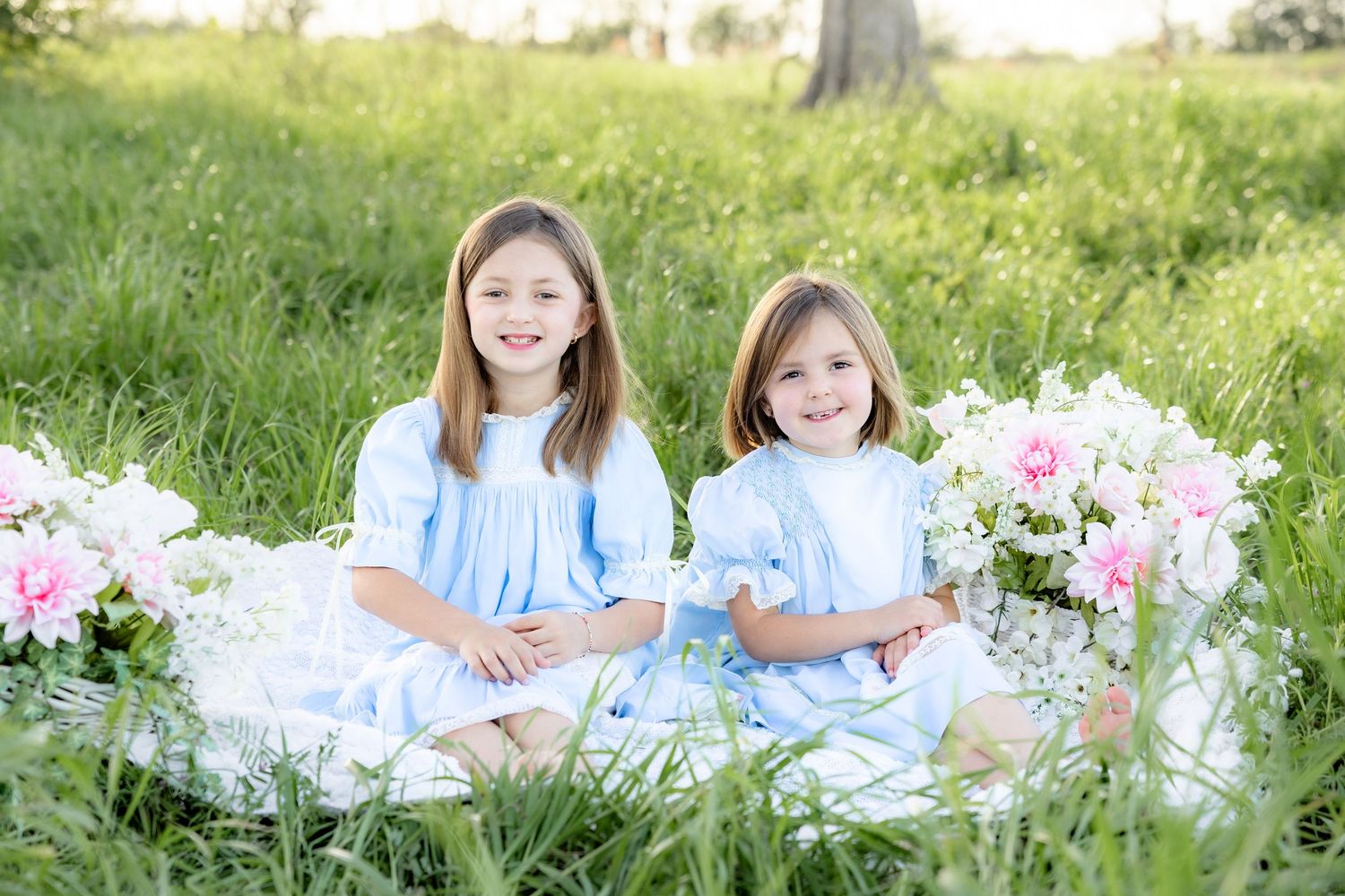Spring Mini Session with baby chicks in a grass field at sunset near Dothan, Alabama