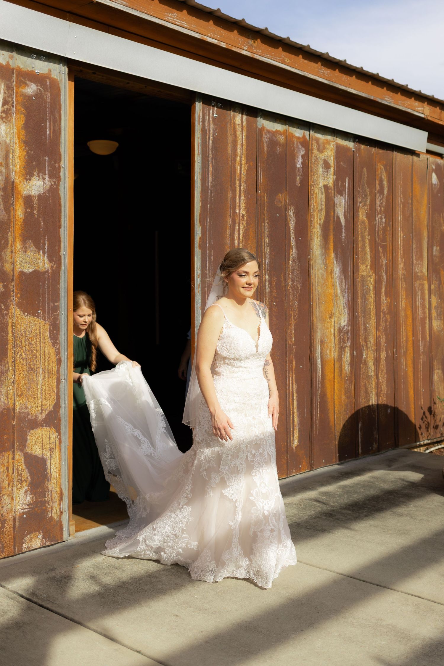 Bride walking to first look underneath the gazebo at Hilltop Acres Wicksburg, Alabama