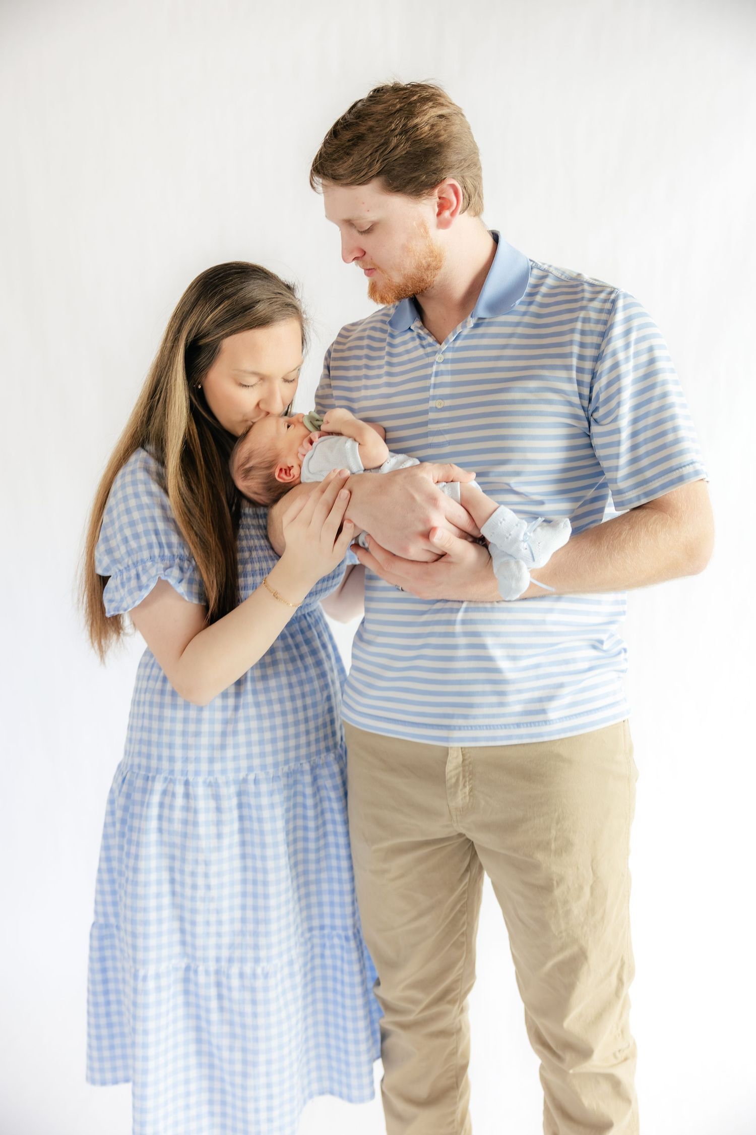 Family holding their baby in a studio in Dothan, Alabama