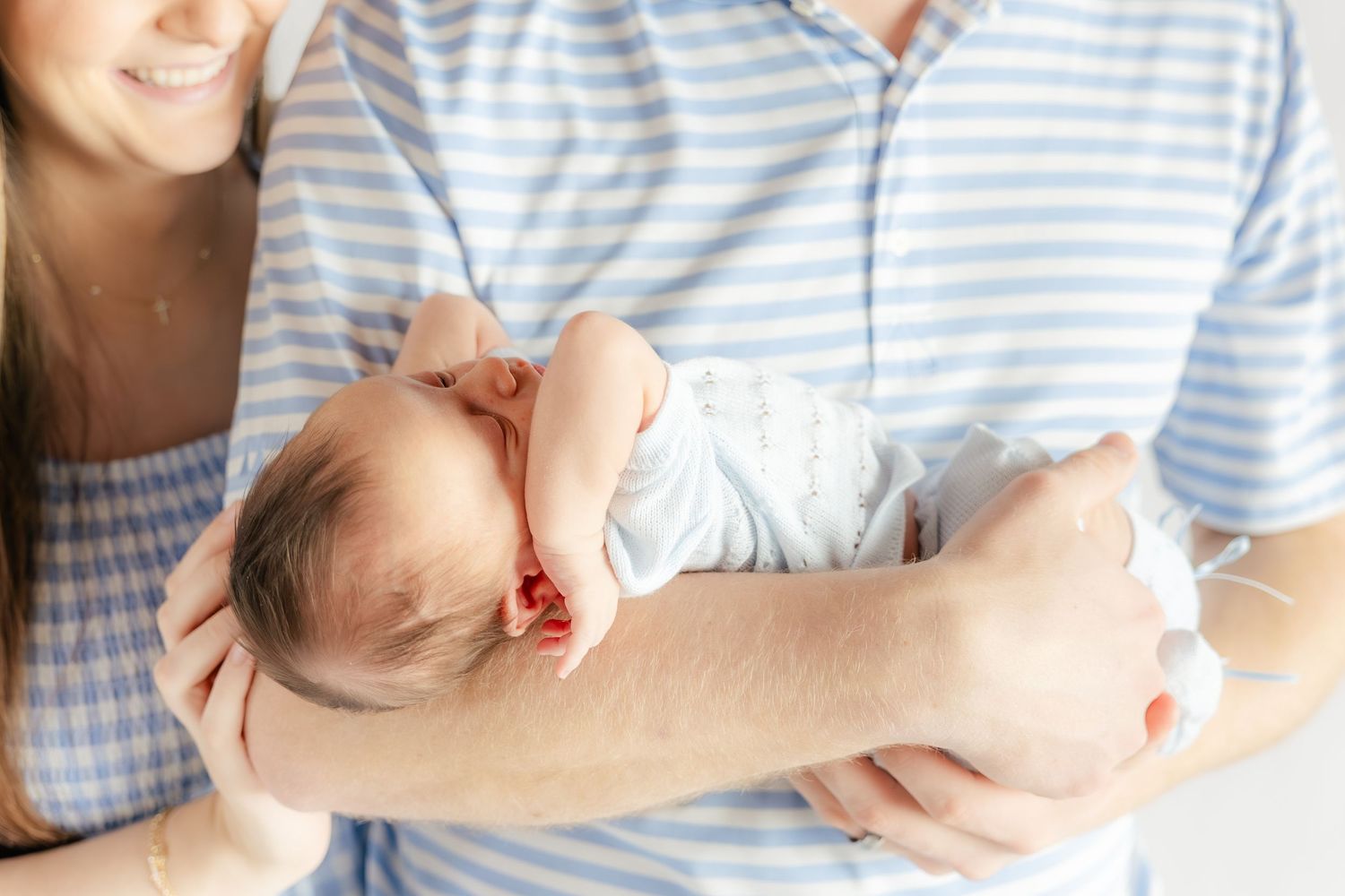 Family holding their baby in a studio in Dothan, Alabama