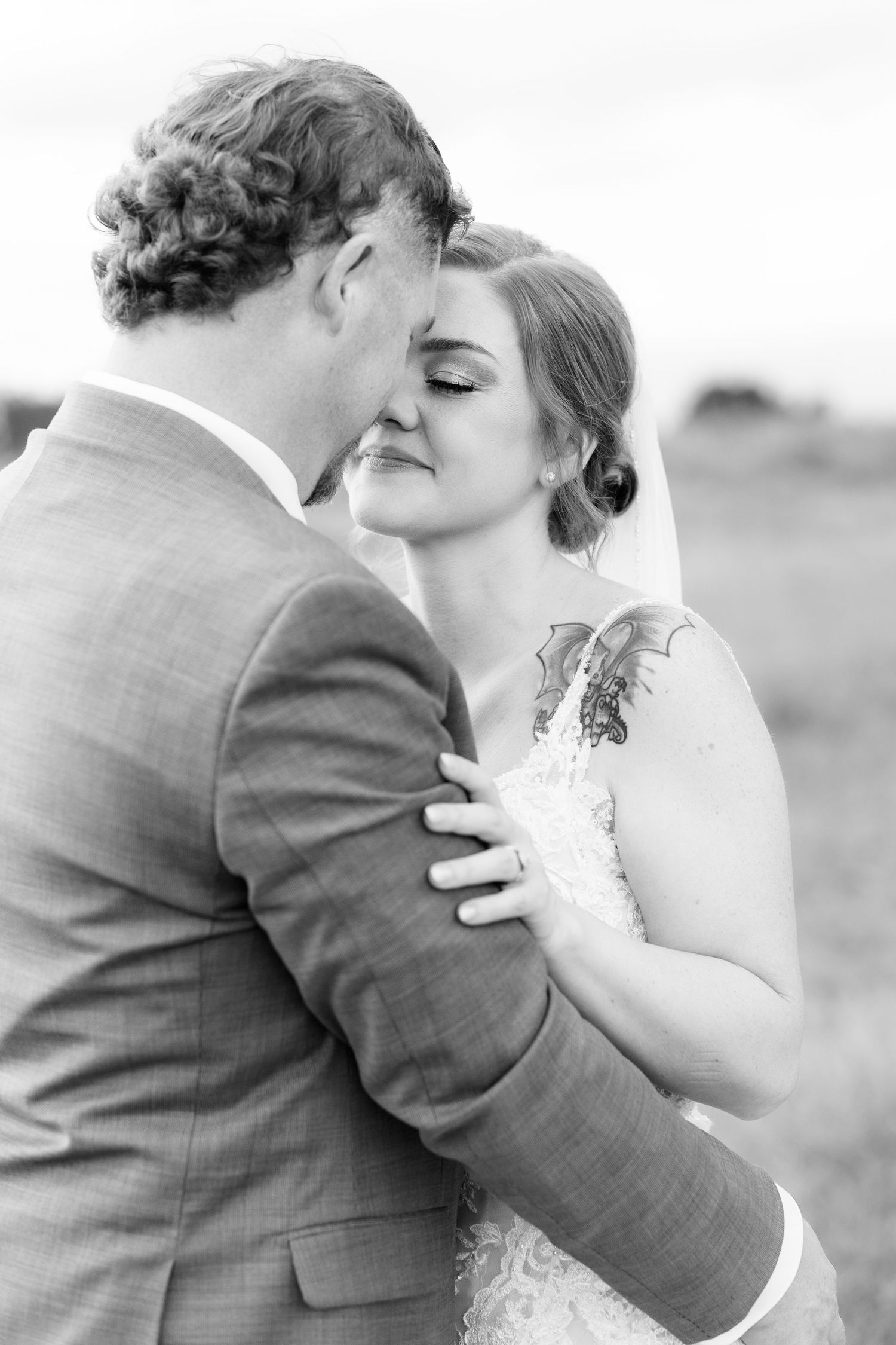 Bride and groom hold each other at sunset at Hilltop Acres Wicksburg, Alabama