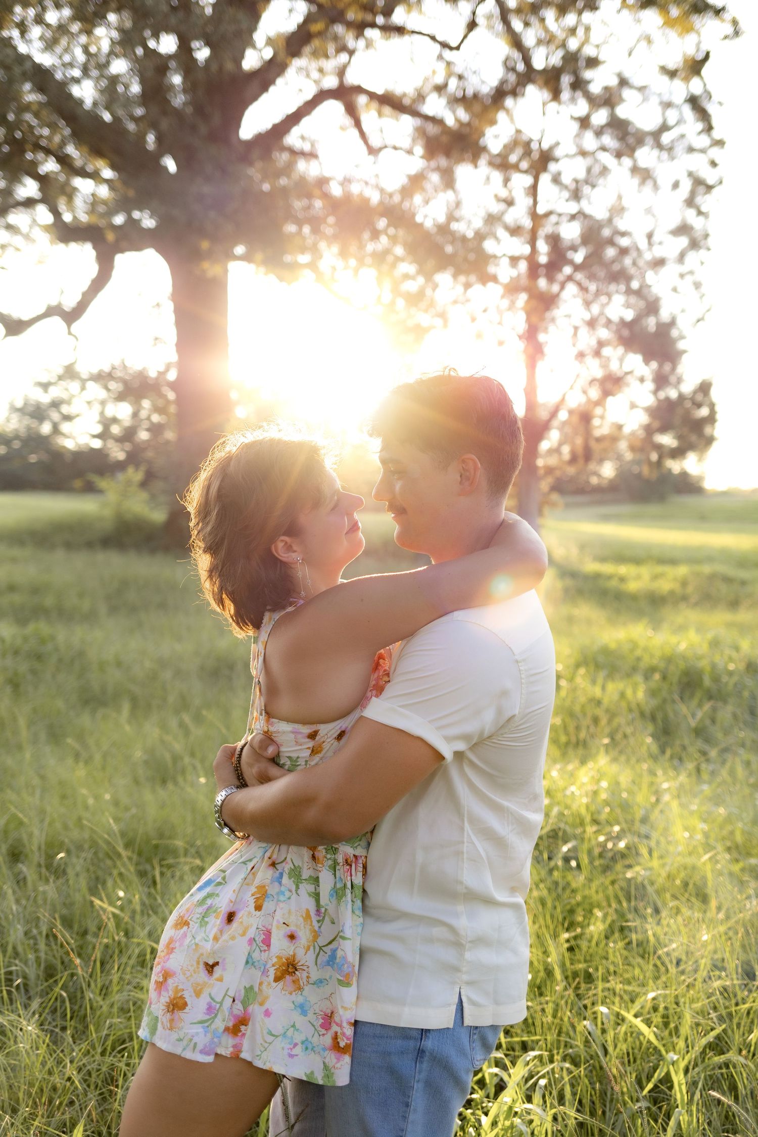 Romantic Couples photos in a tall grass field at sunset near Dothan, Alabama