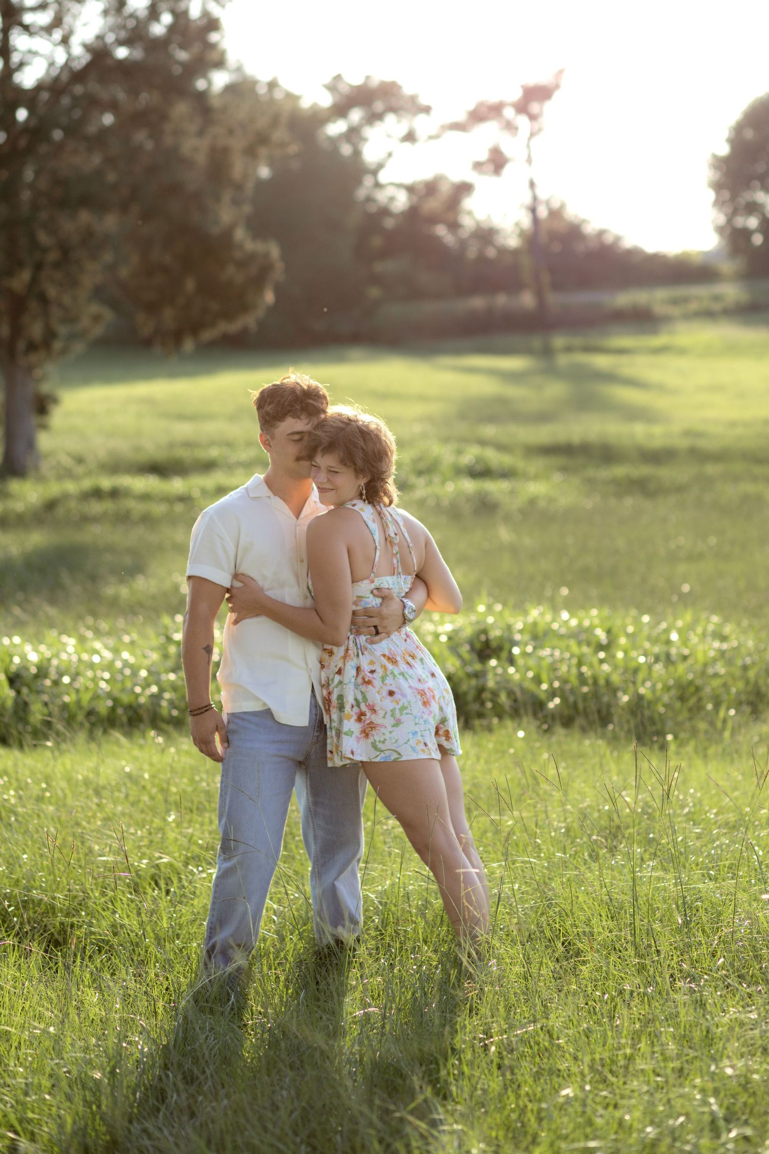 Romantic Couples photos in a tall grass field at sunset near Dothan, Alabama