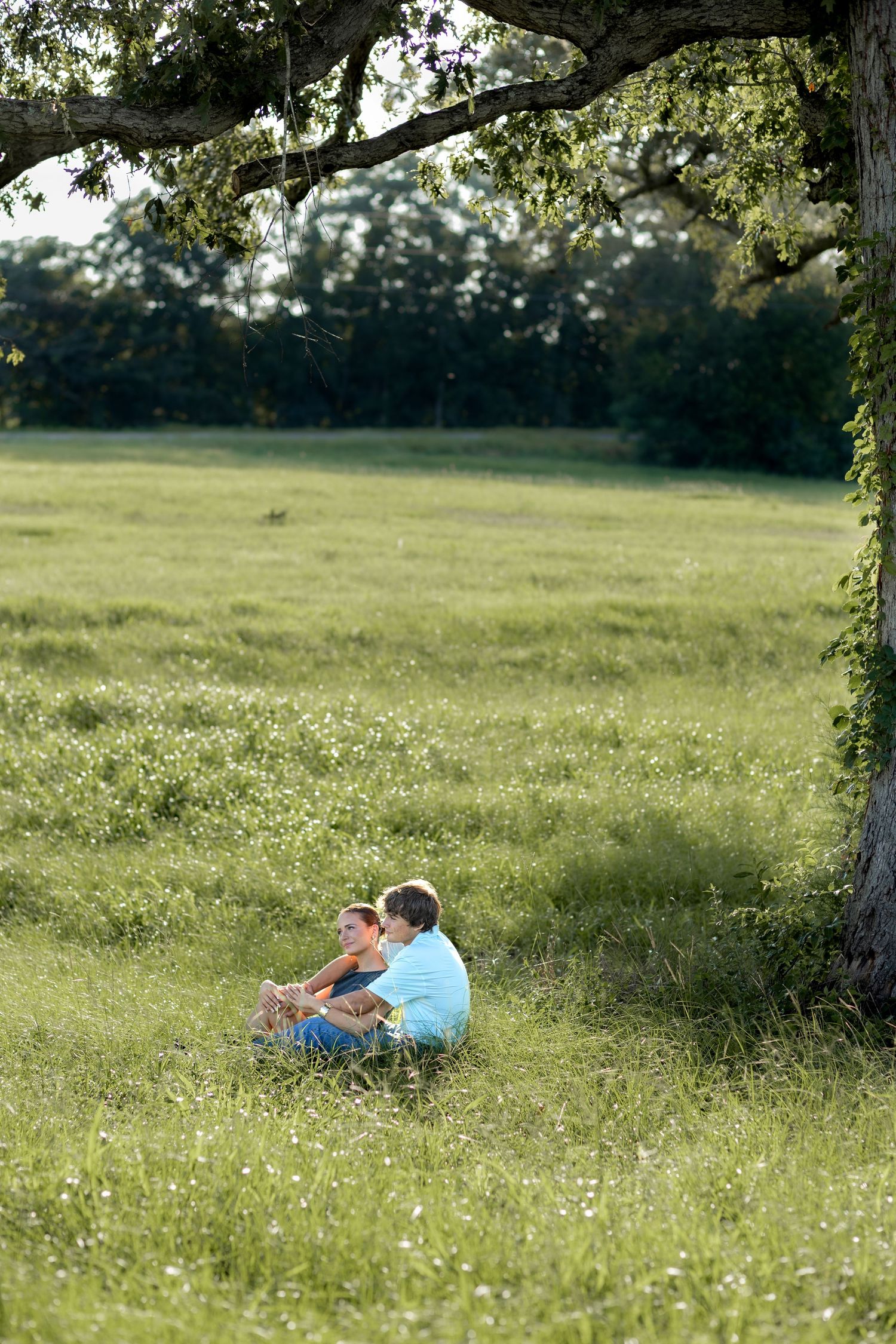 Romantic Couples photos in a tall grass field at sunset near Dothan, Alabama