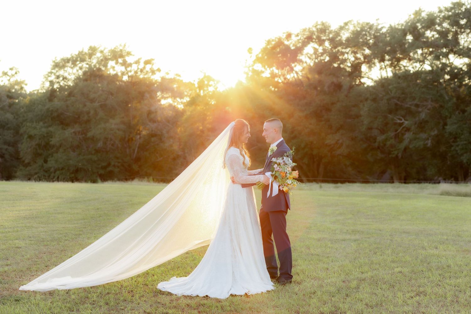 Bride and groom holding each other for portraits at Dalrymple Farms Enterprise, Alabama