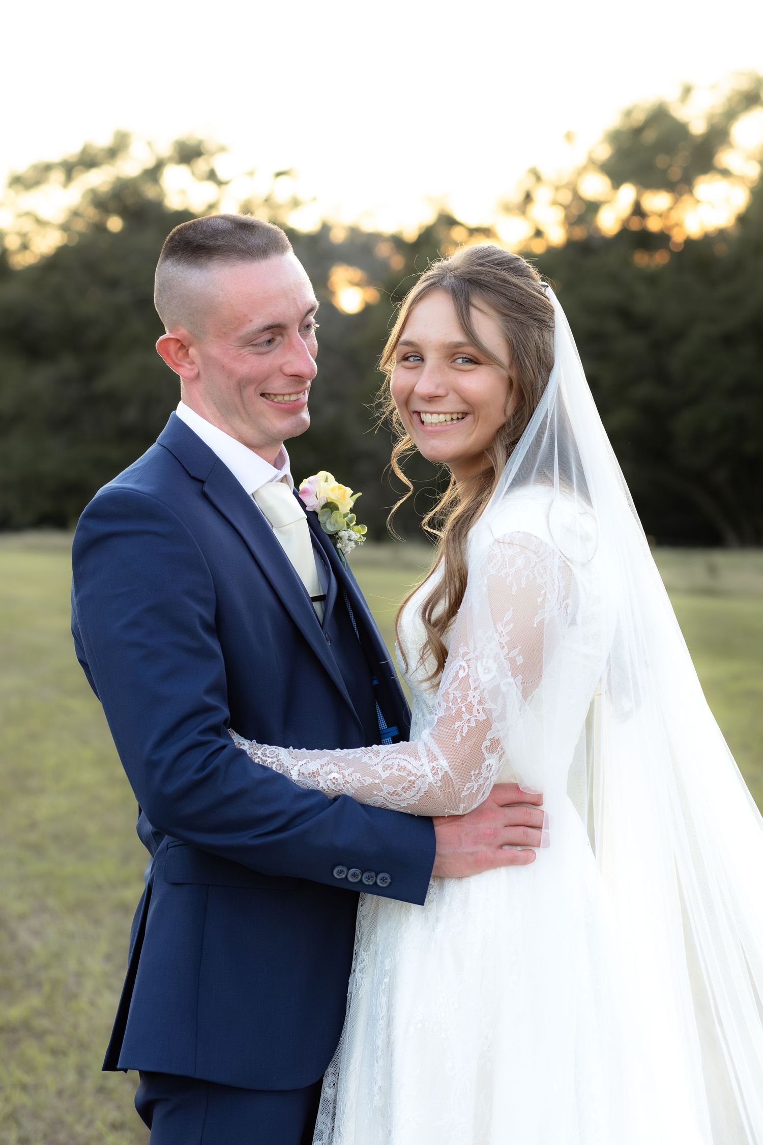 Bride and groom holding each other for portraits at Dalrymple Farms Enterprise, Alabama