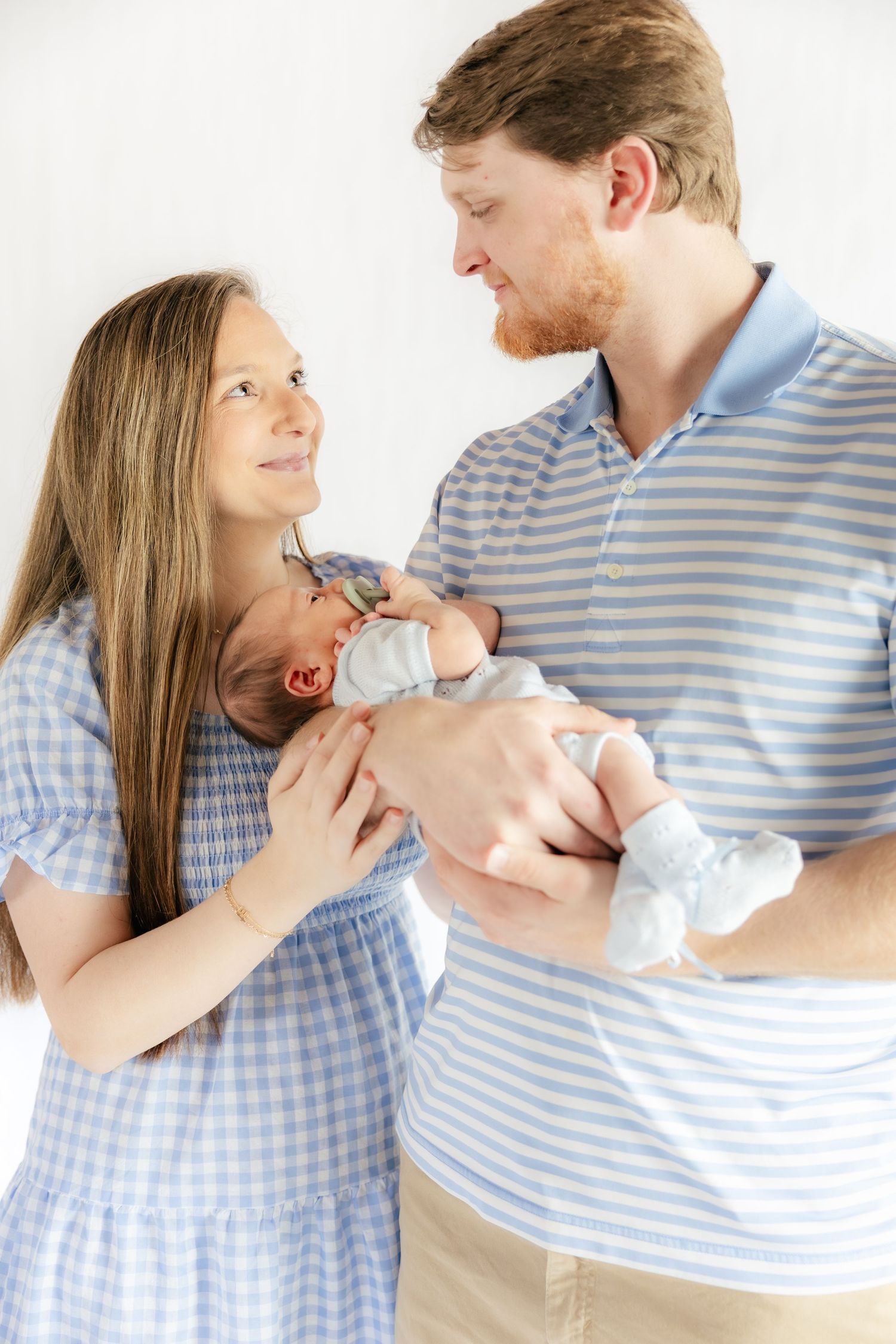 Family holding their baby in a studio in Dothan, Alabama