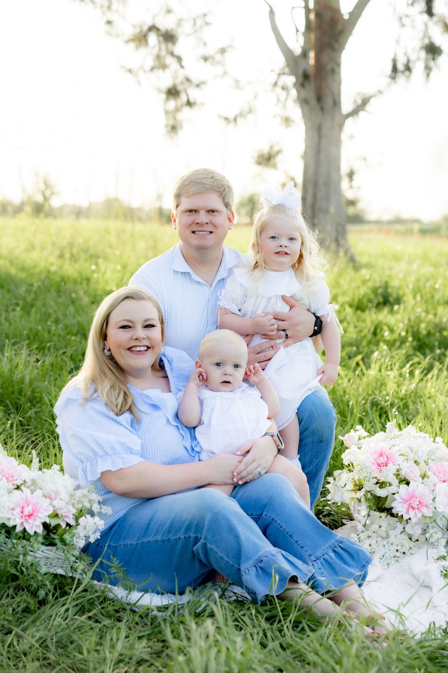 Spring Mini Session with baby chicks in a grass field at sunset near Dothan, Alabama
