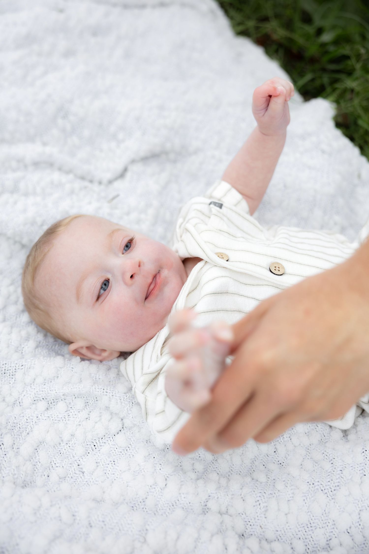 Candid family photos in a grass field | Dothan, Alabama Lifestyle Portrait Photographer