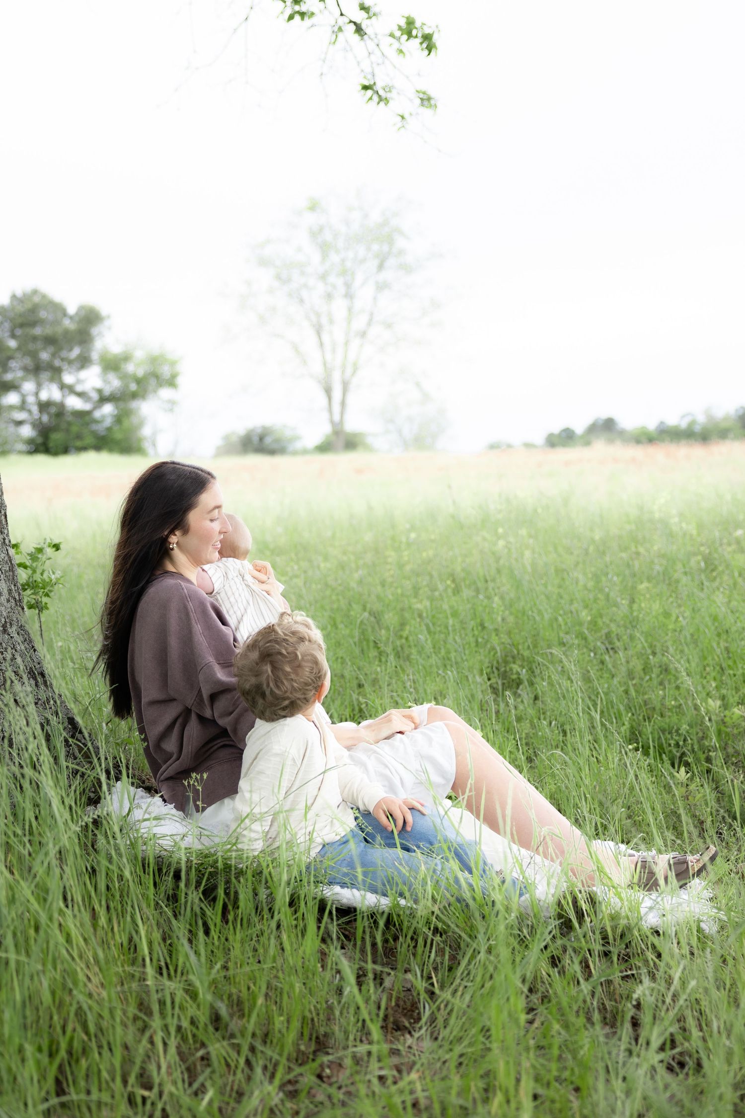 Candid family photos in a grass field | Dothan, Alabama Lifestyle Portrait Photographer