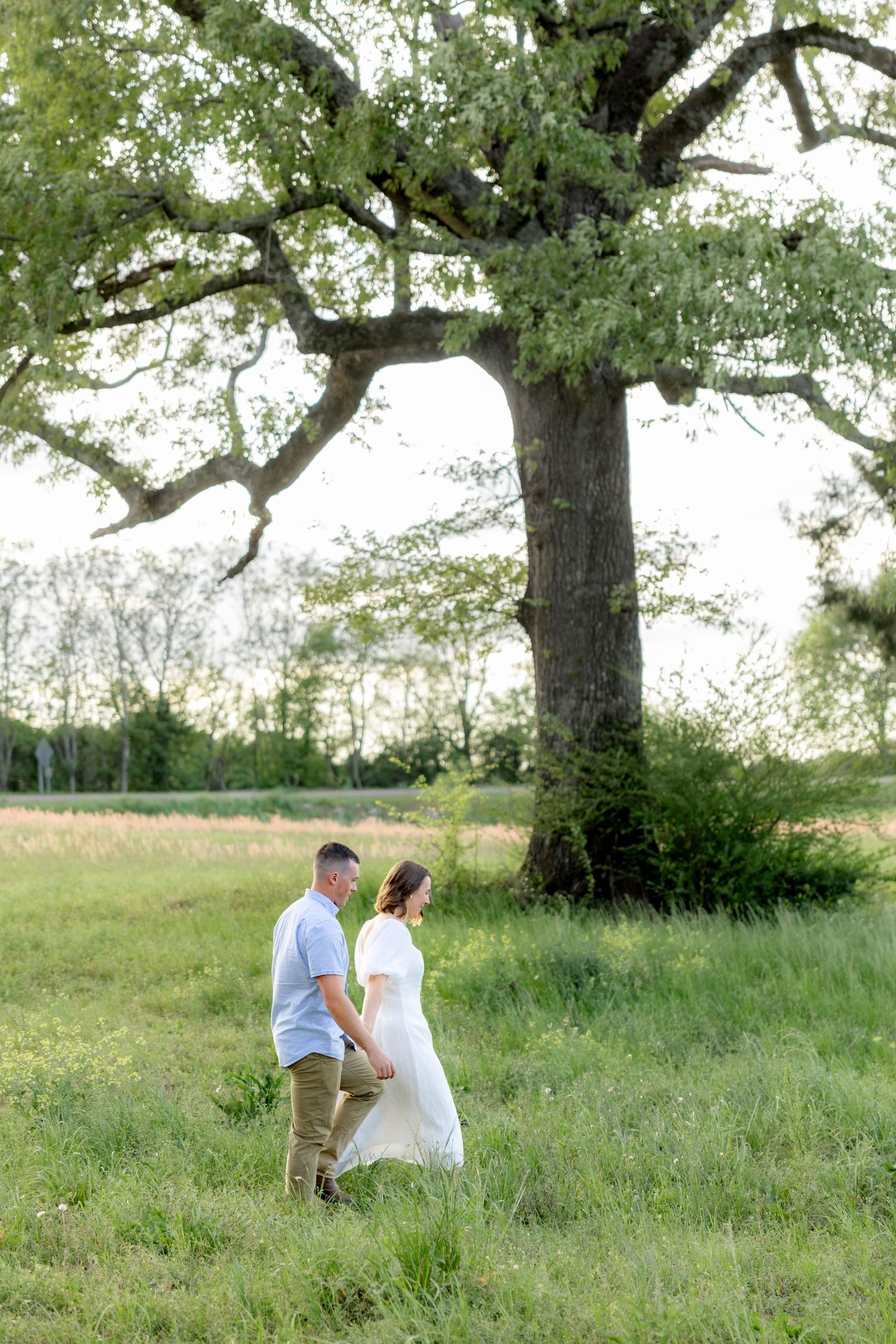 Storytelling romantic couple photos in a tall grass field at sunset in Dothan, Alabama