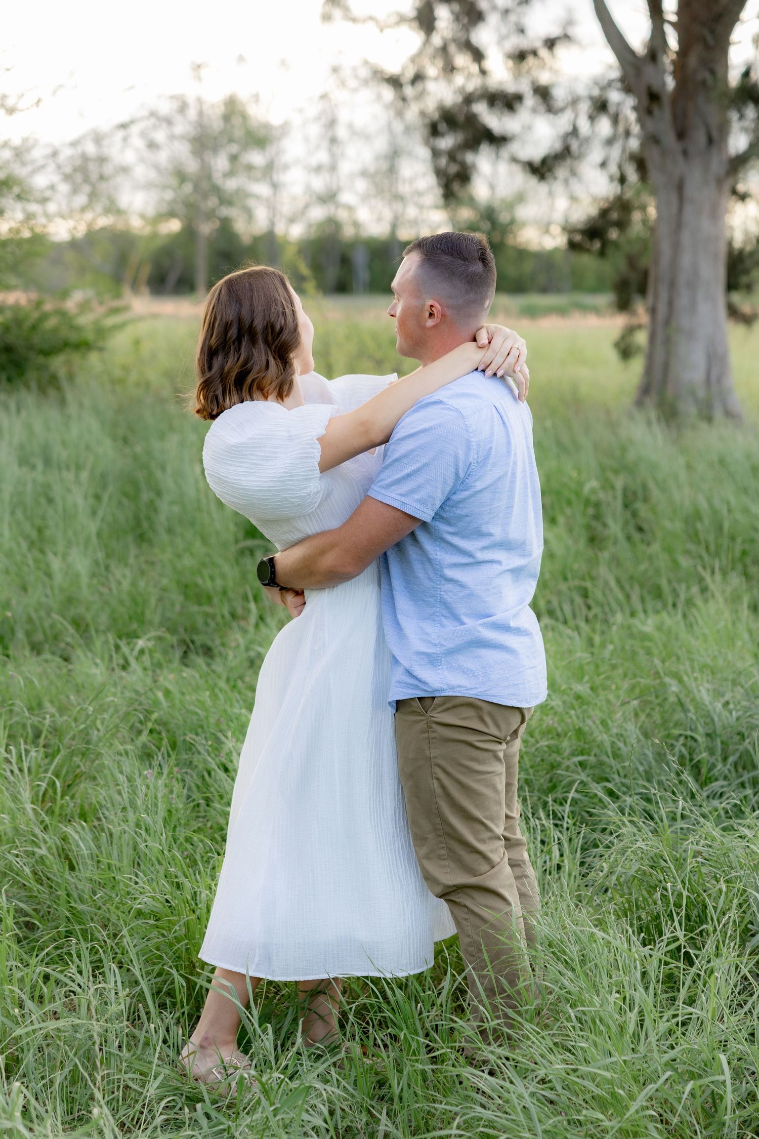 Storytelling romantic couple photos in a tall grass field at sunset in Dothan, Alabama
