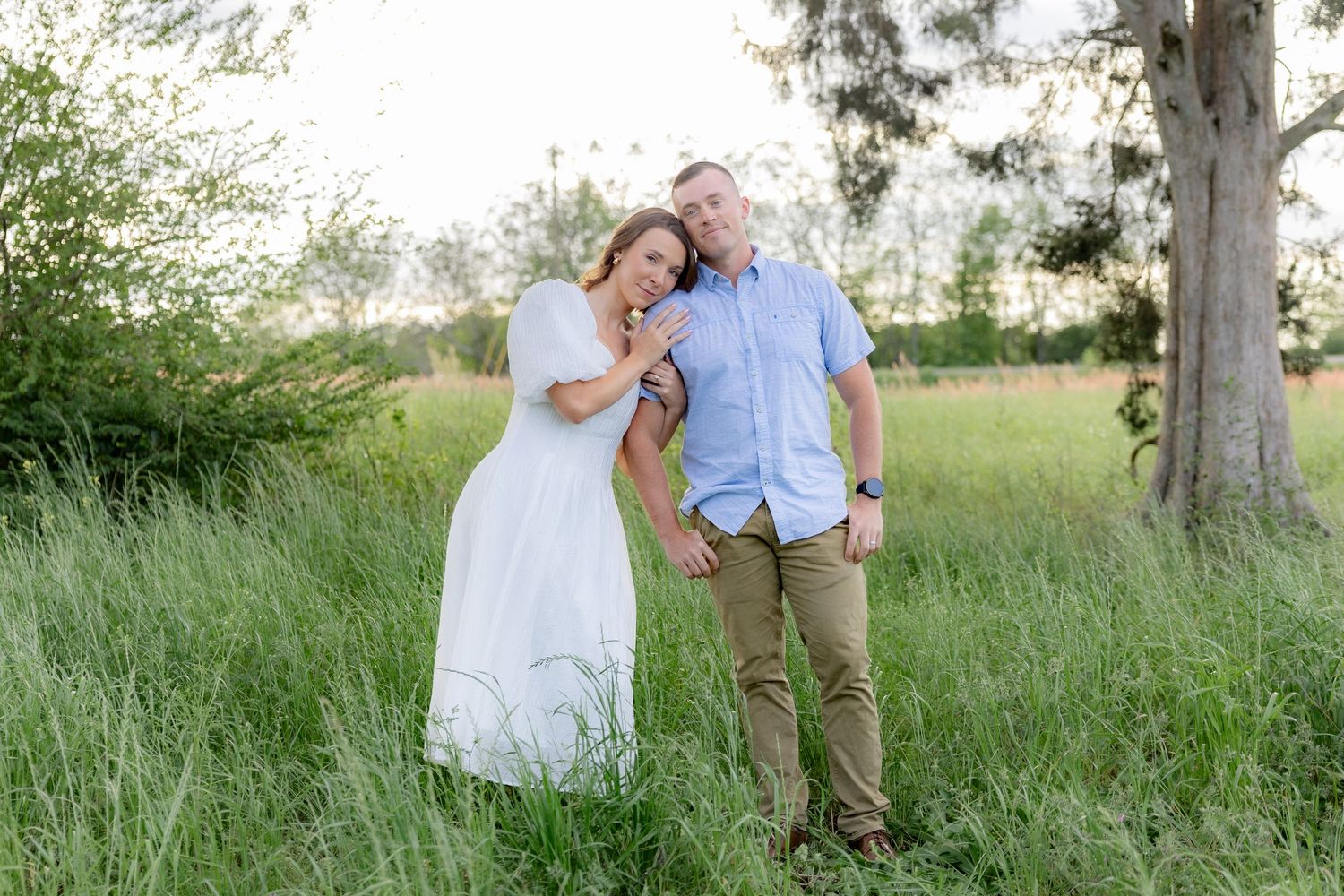Storytelling romantic couple photos in a tall grass field at sunset in Dothan, Alabama